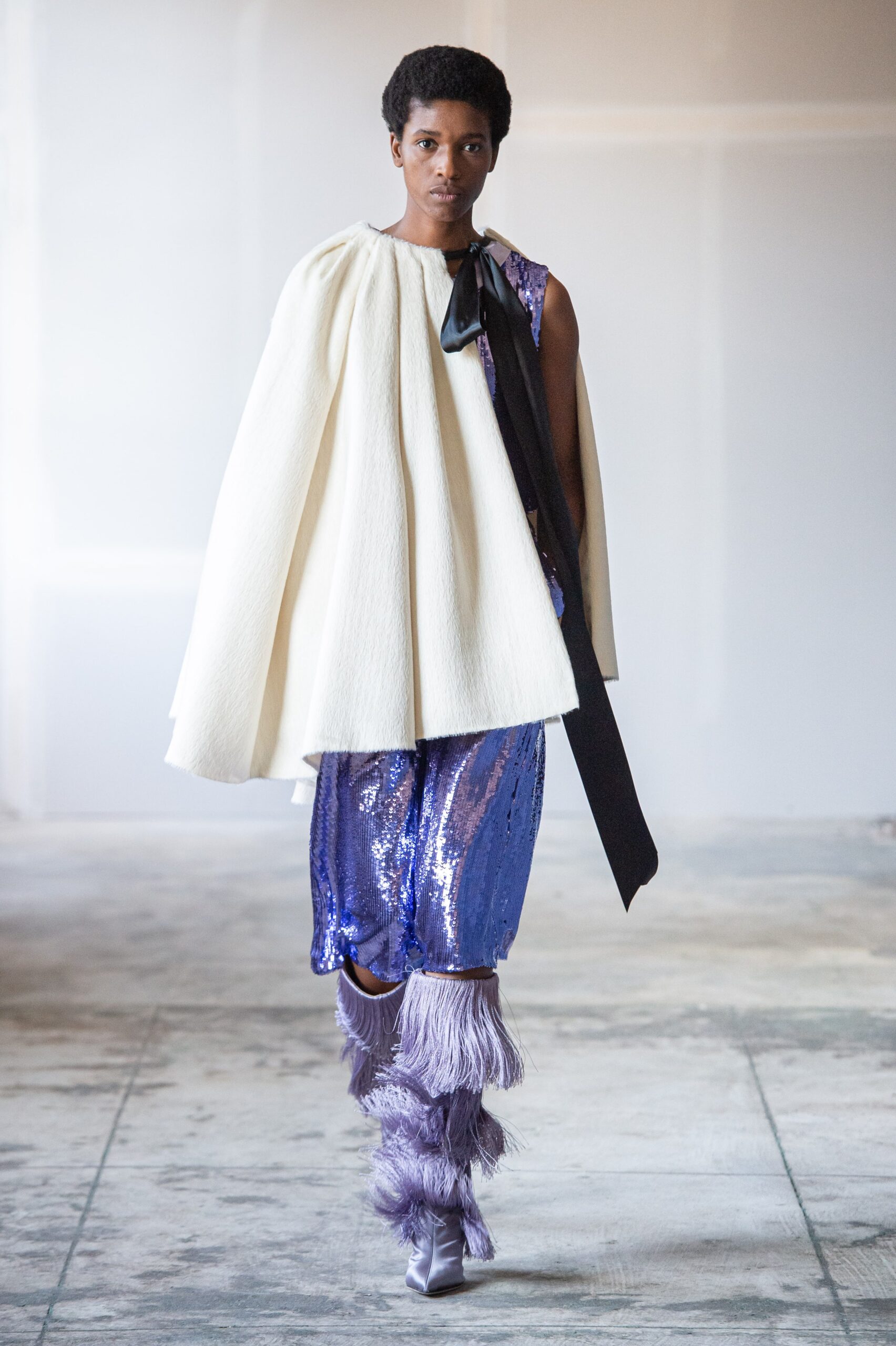 white wool cape with sequined shorts