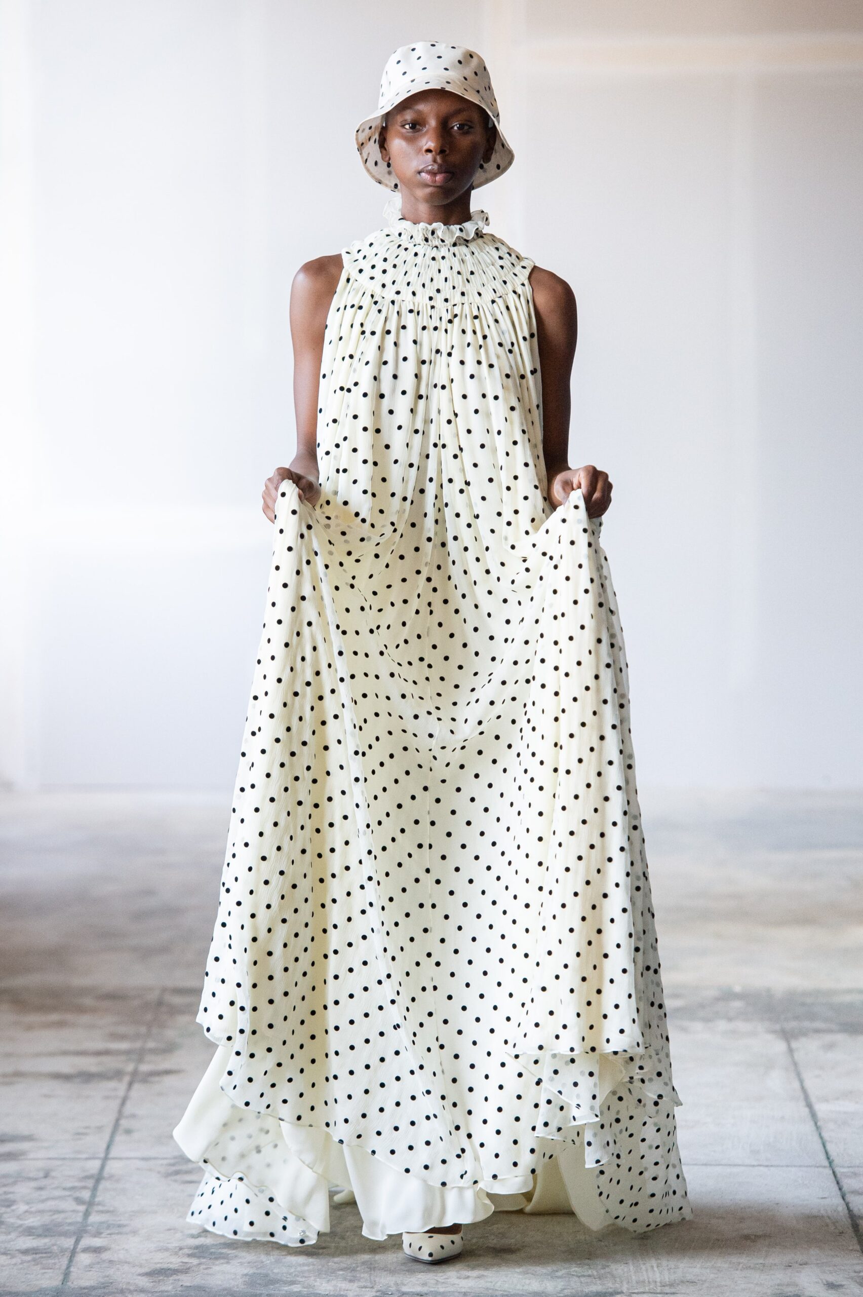 white polka-dot maxi dress and hat