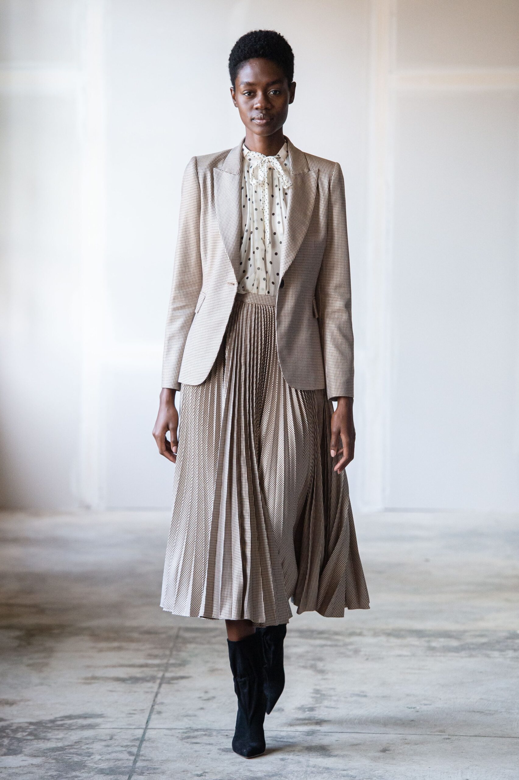 beige tailored blazer with pleated skirt