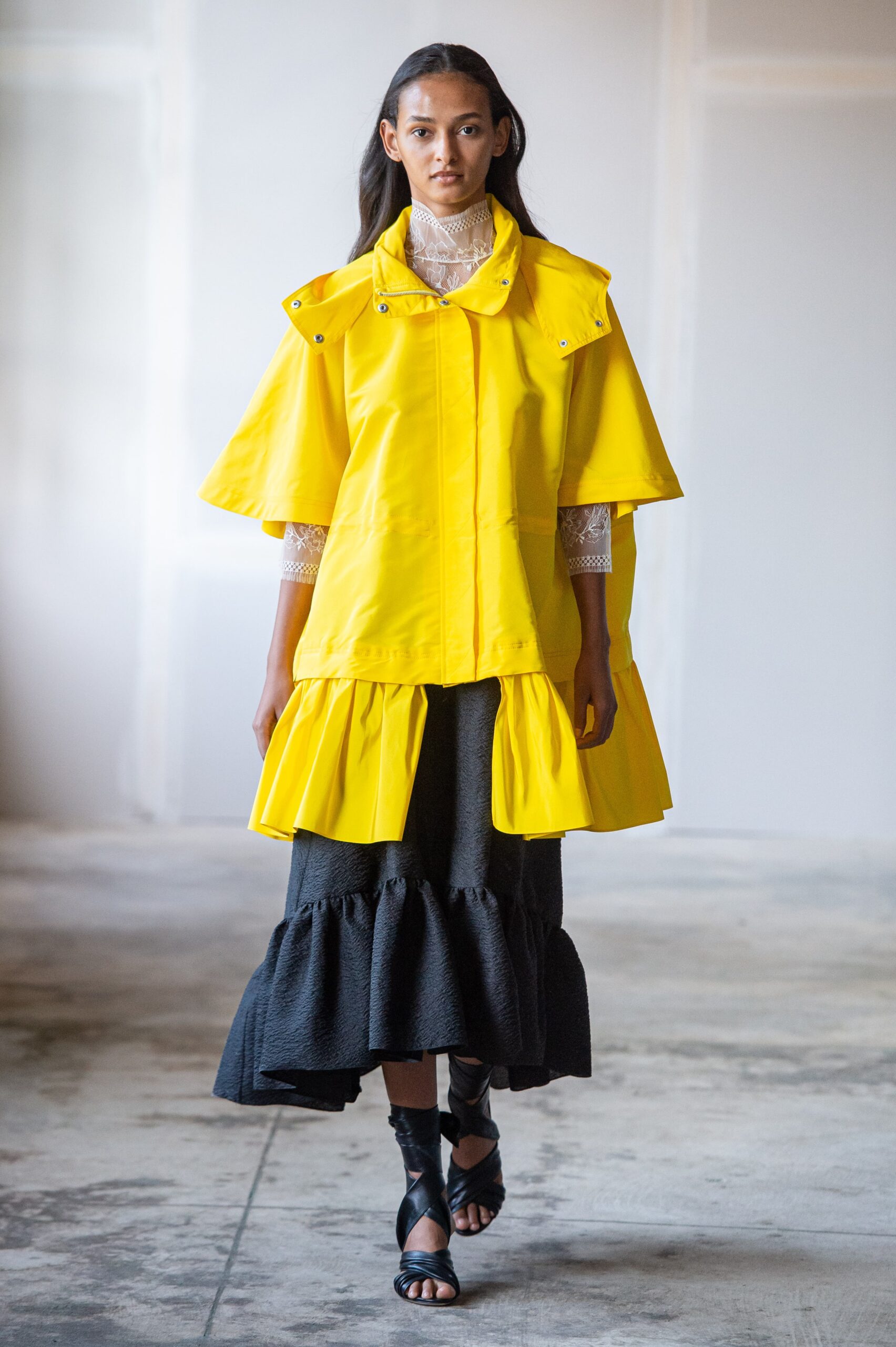 yellow coat with black tiered skirt