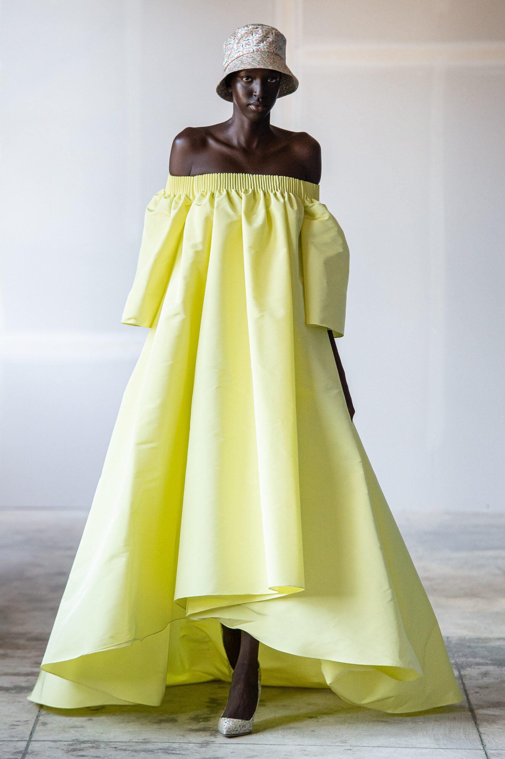 yellow off-shoulder maxi dress with hat