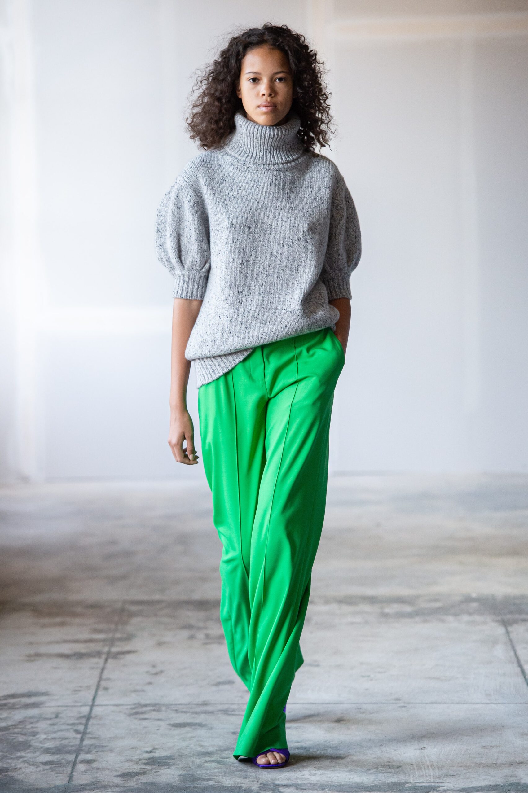 gray relaxed sweater with green pants