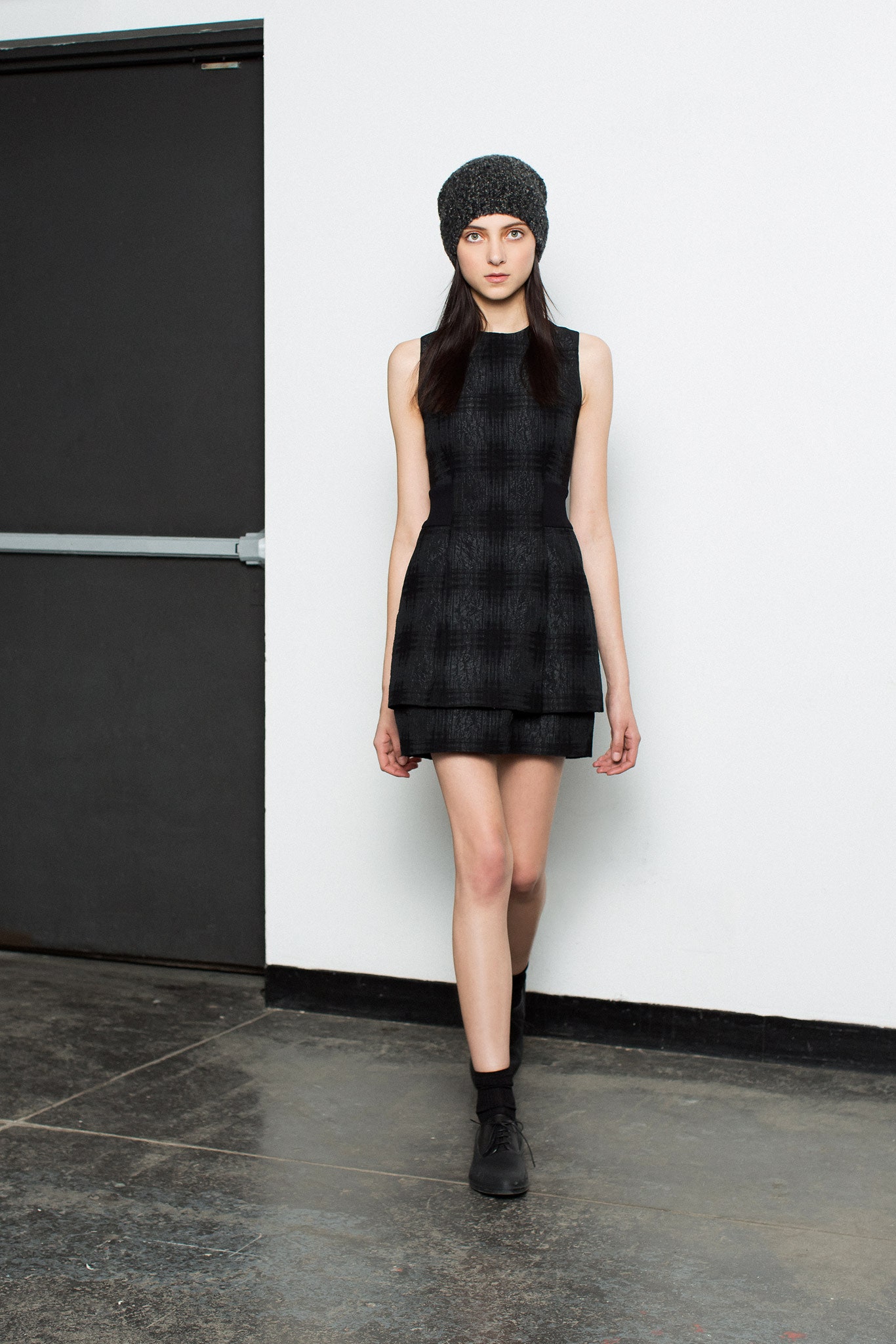 black fitted mini dress with knit hat