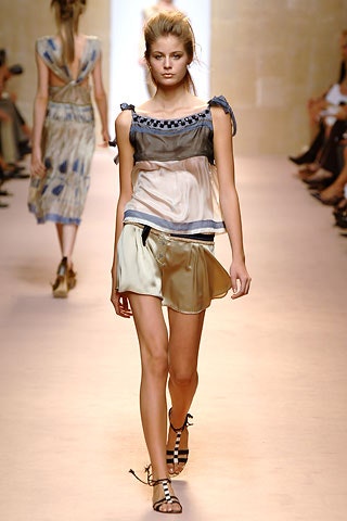 blue silk sleeveless top with gold mini skirt