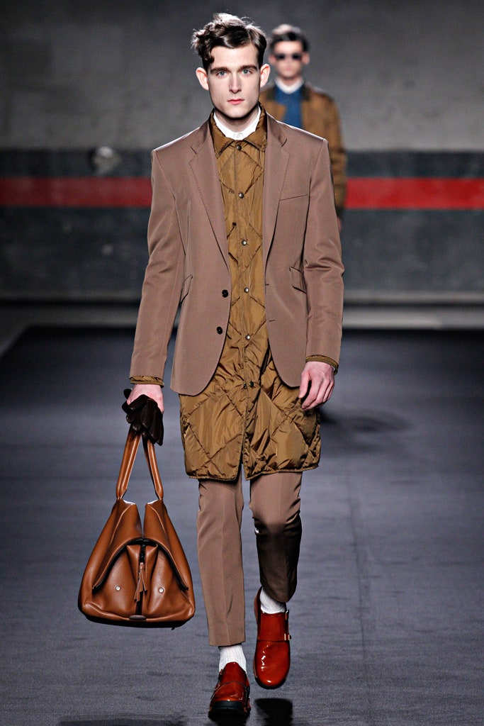 brown tailored suit with beige shirt