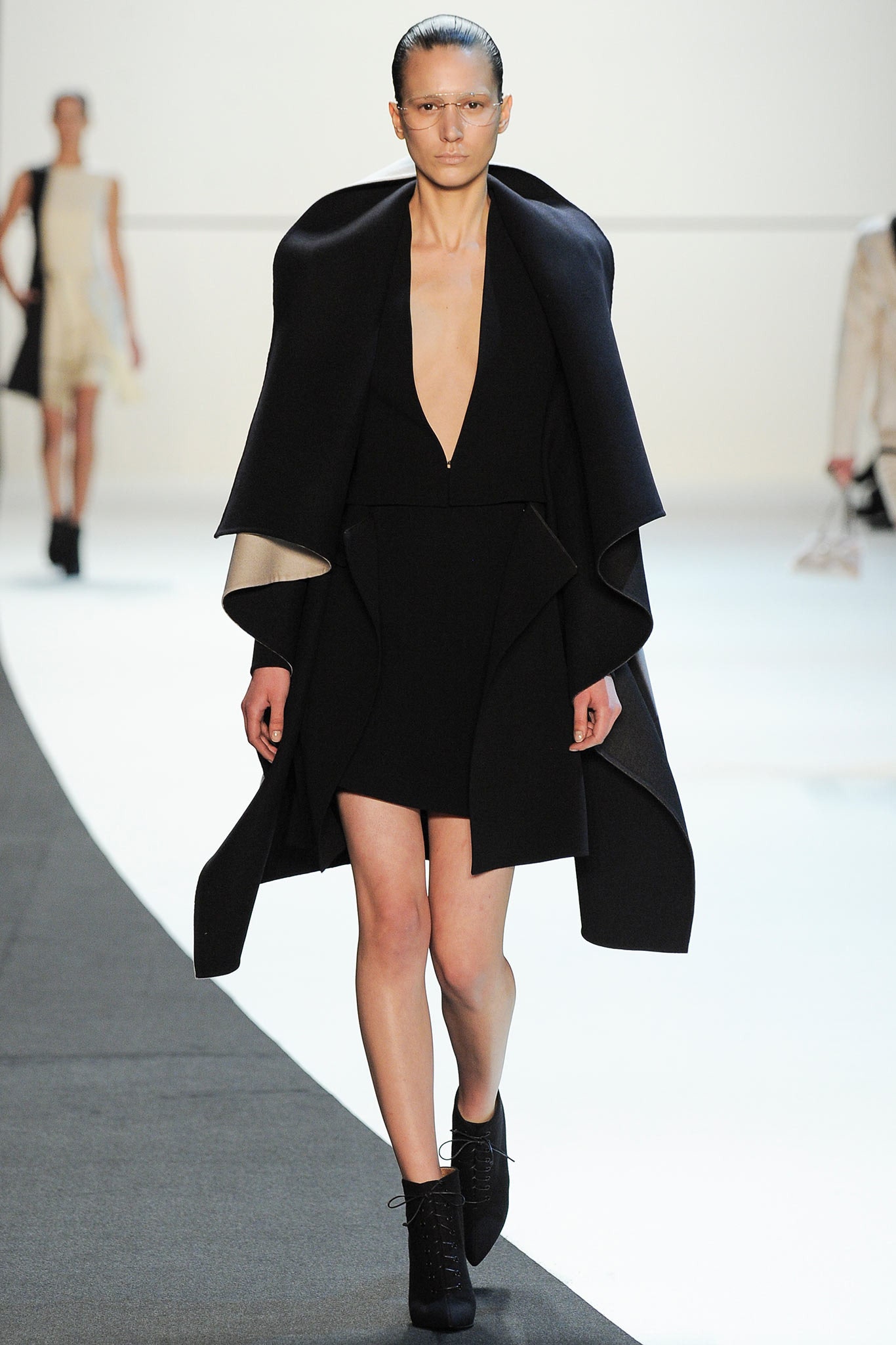 black fitted dress with cape