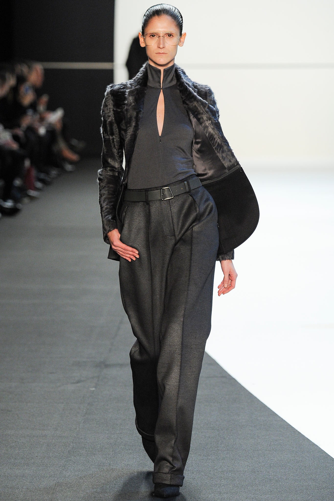 black fur jacket with fitted top and relaxed pants