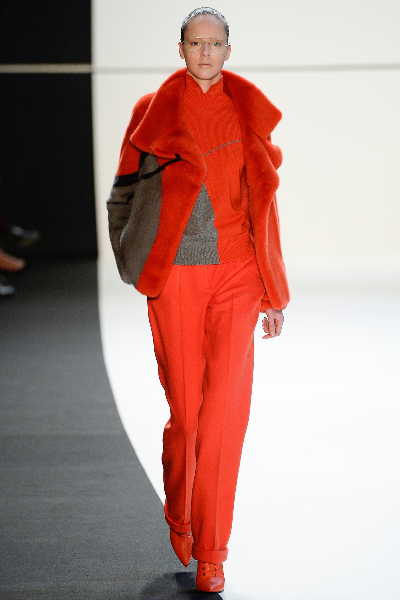 red fur coat with tailored pants