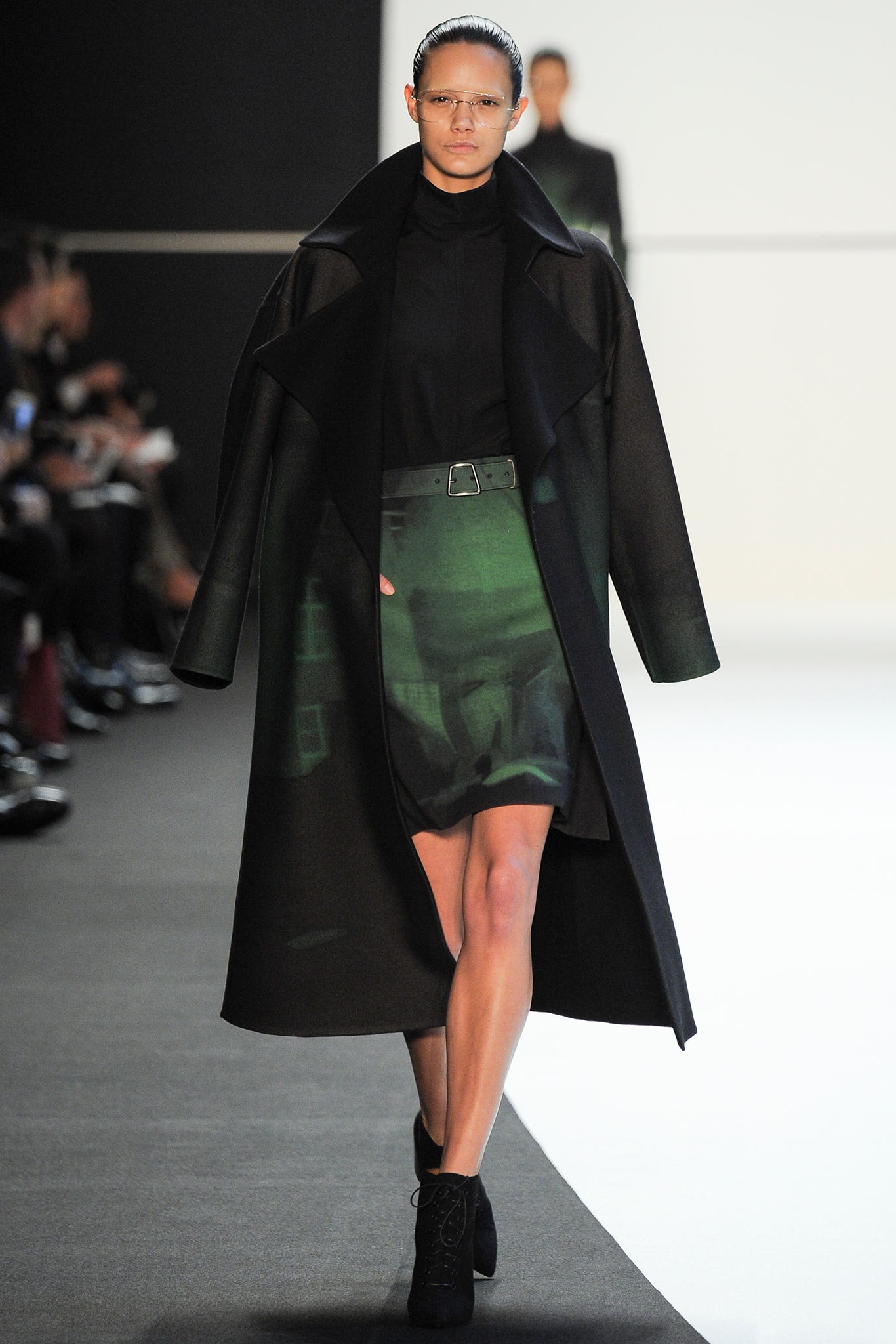 black wool coat and green silk dress