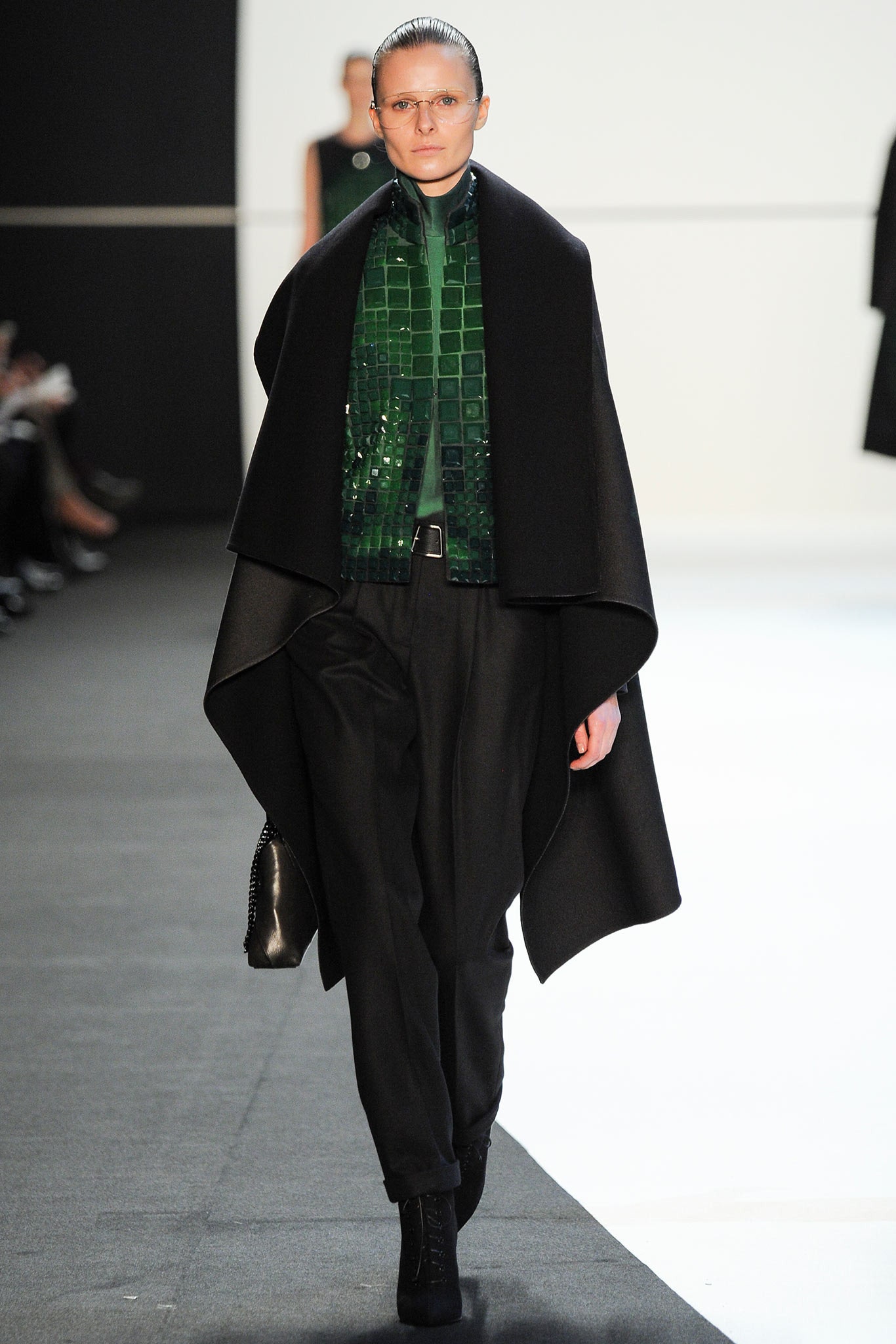 black wool cape with green top