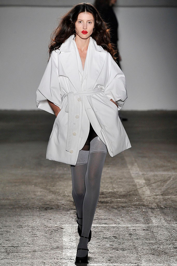 white relaxed coat with black shorts