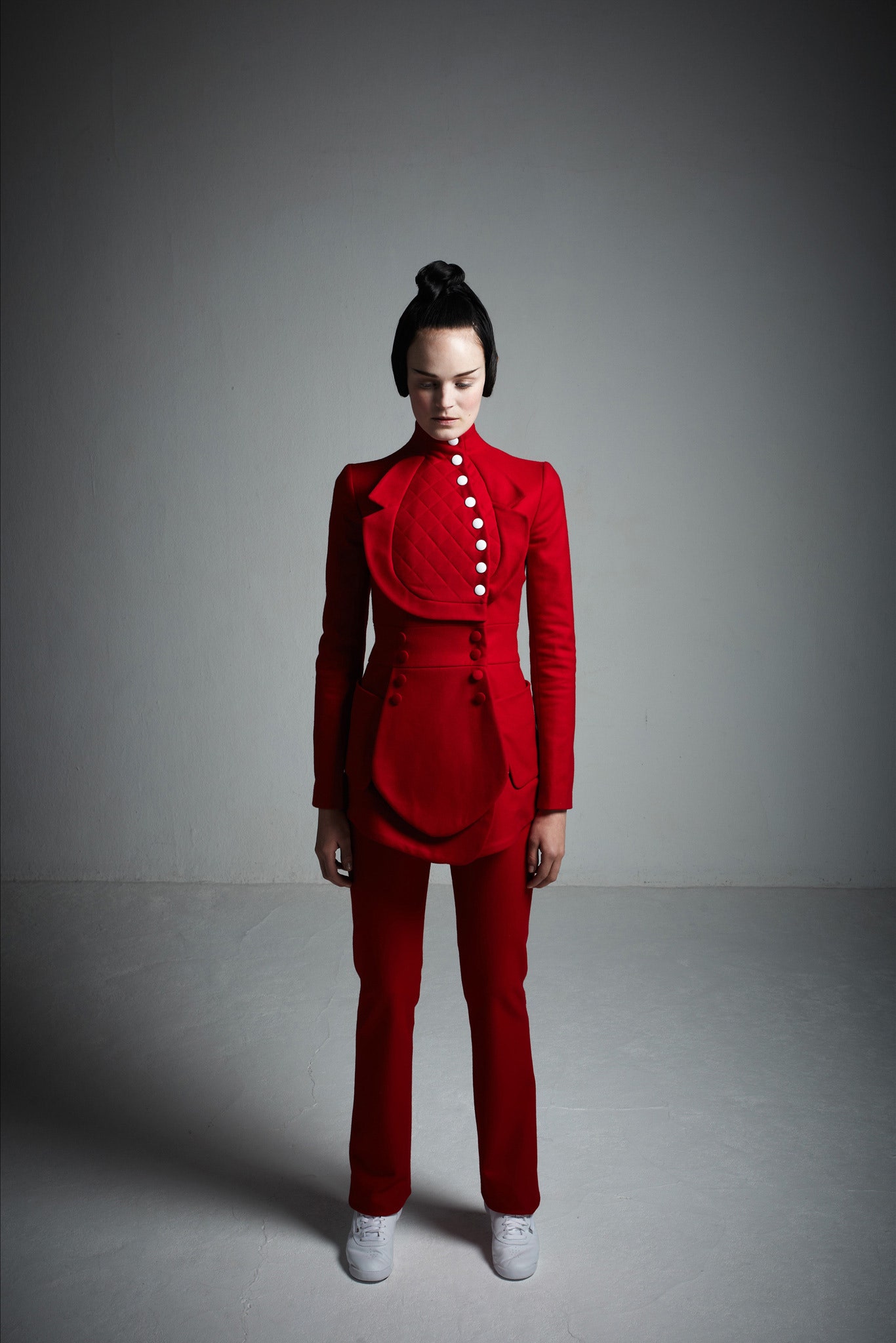 red fitted suit with white shoes