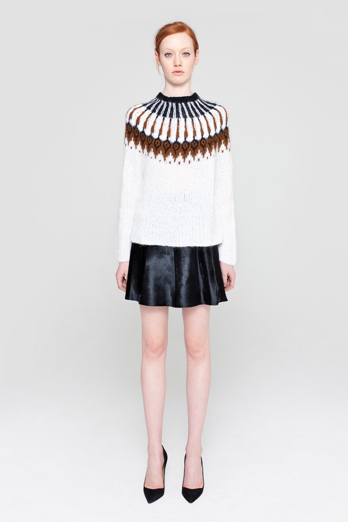 white wool sweater with black leather skirt