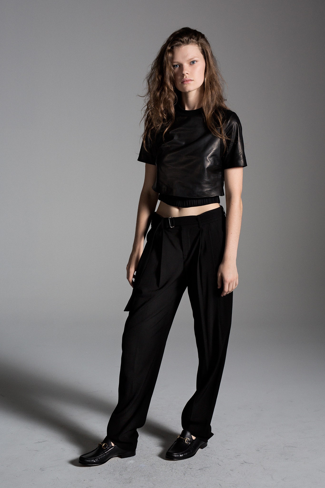 black leather cropped top and relaxed pants