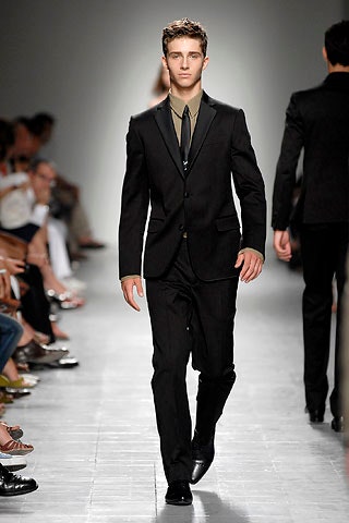 black tailored suit with olive shirt