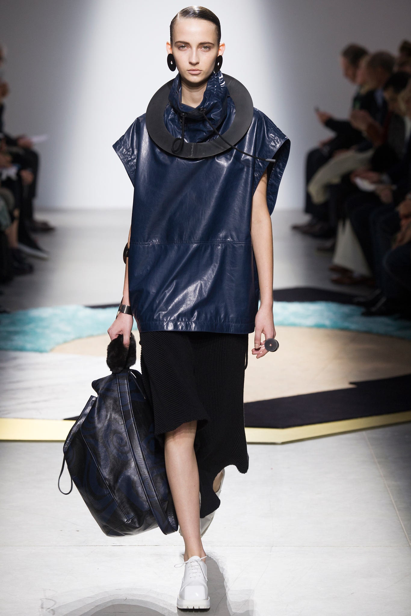 blue vinyl sleeveless top and black knit skirt