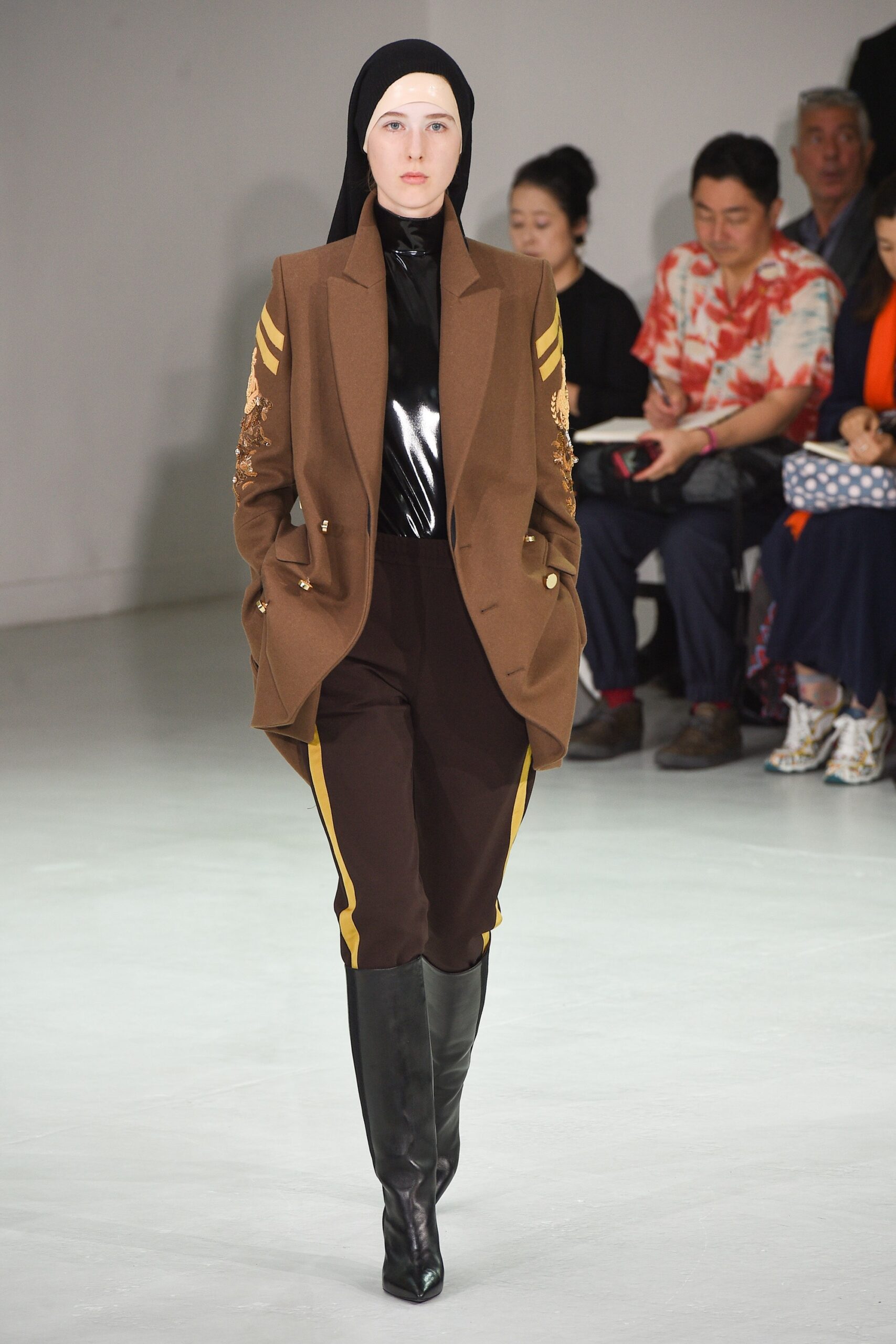 brown tailored blazer with black pants