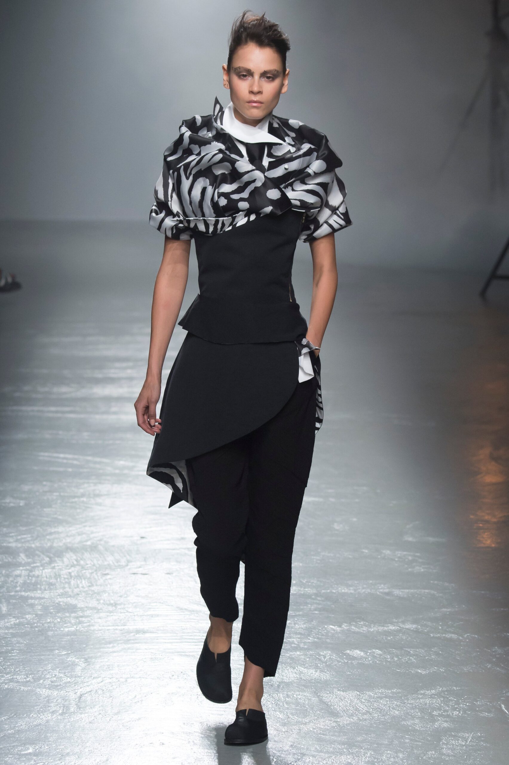 black and white asymmetric top with slim pants