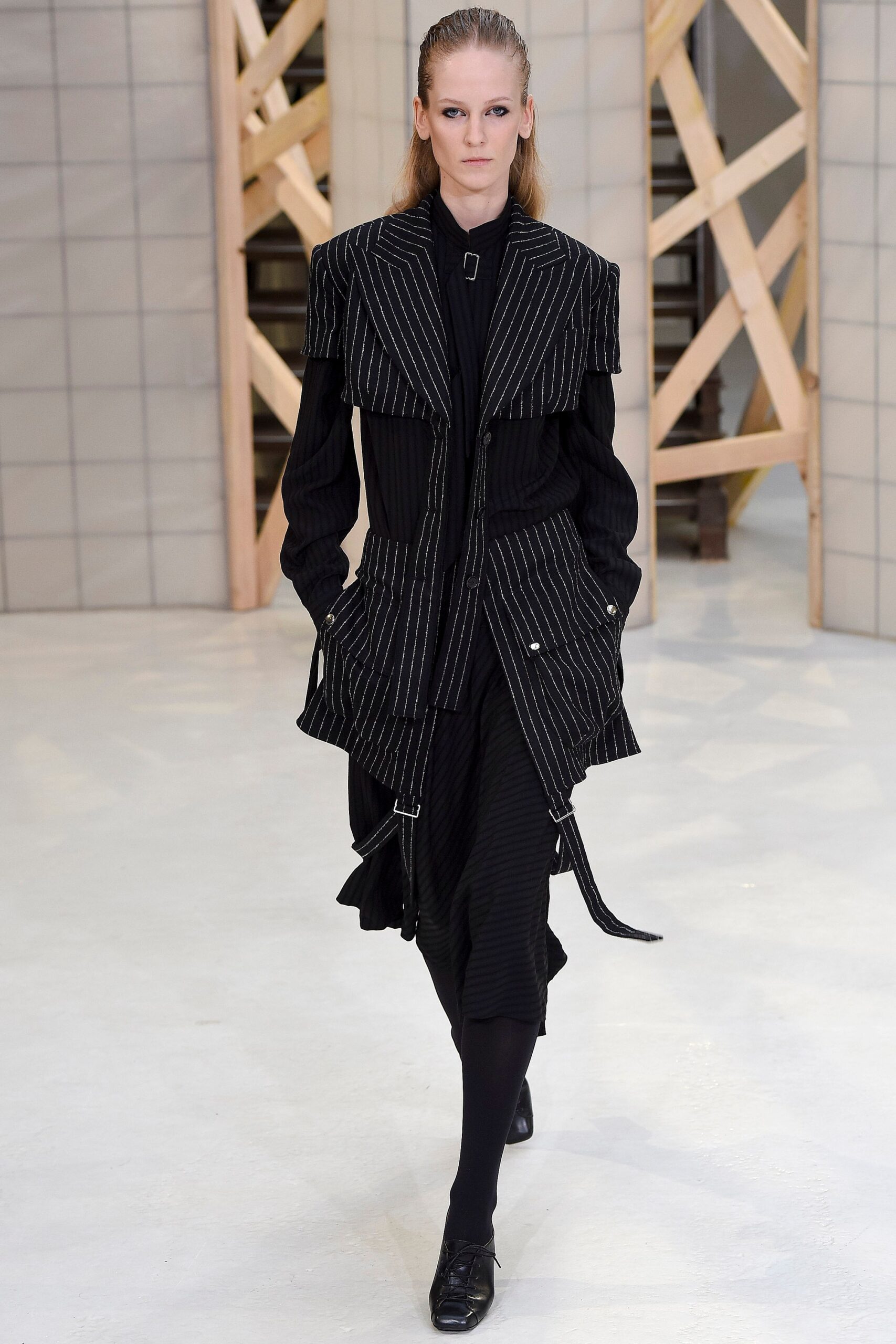 black fitted midi dress and structured jacket