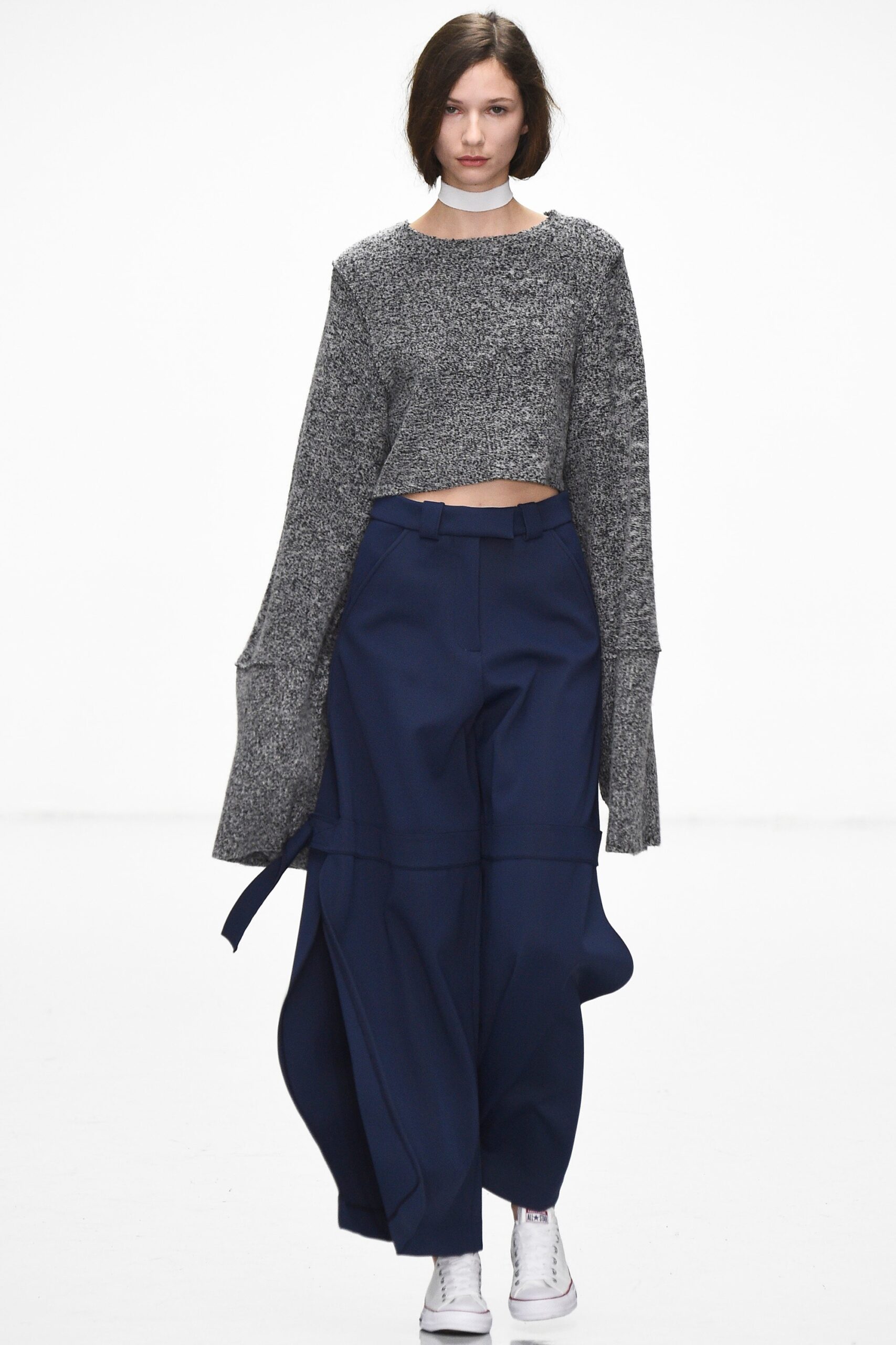 gray cropped top with blue pants