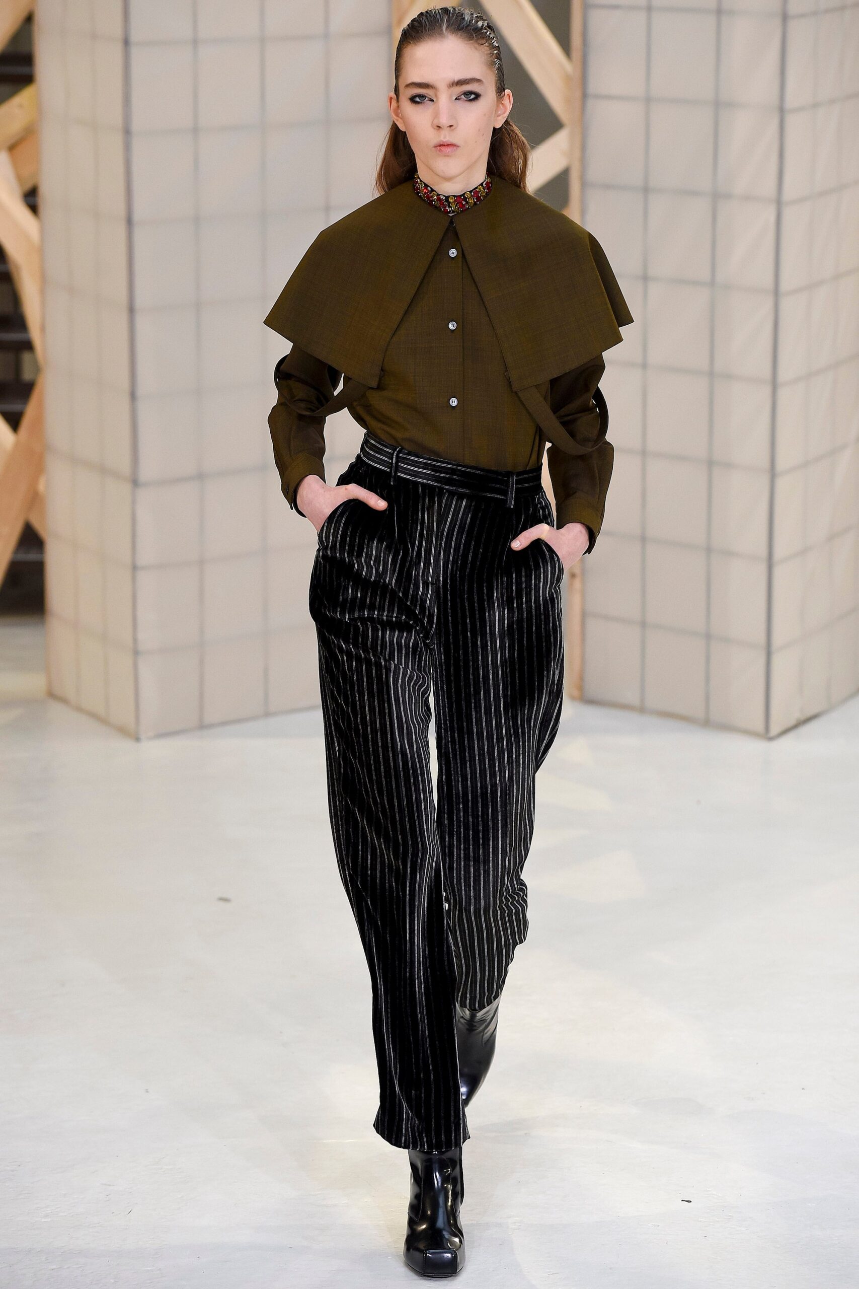 green collared shirt and black striped pants