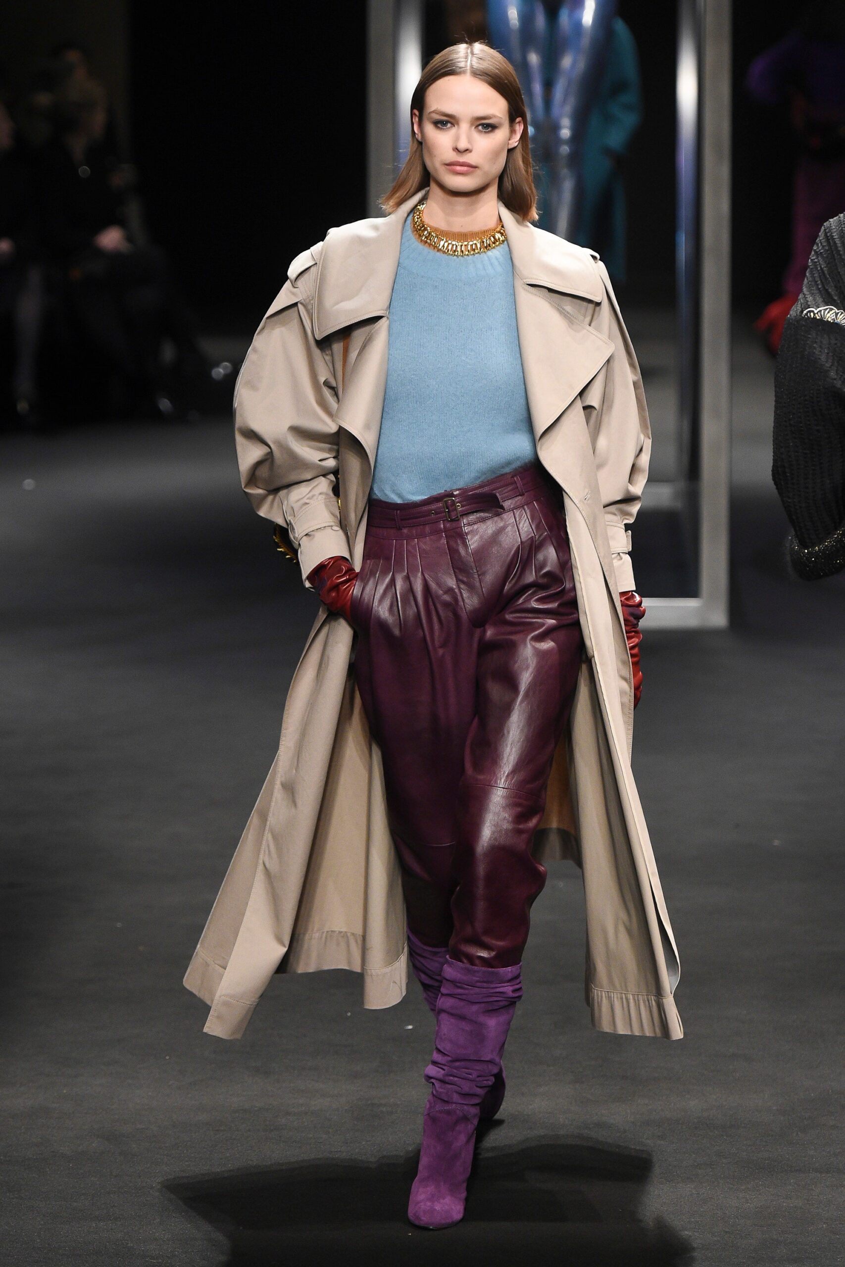 beige coat blue sweater purple pants