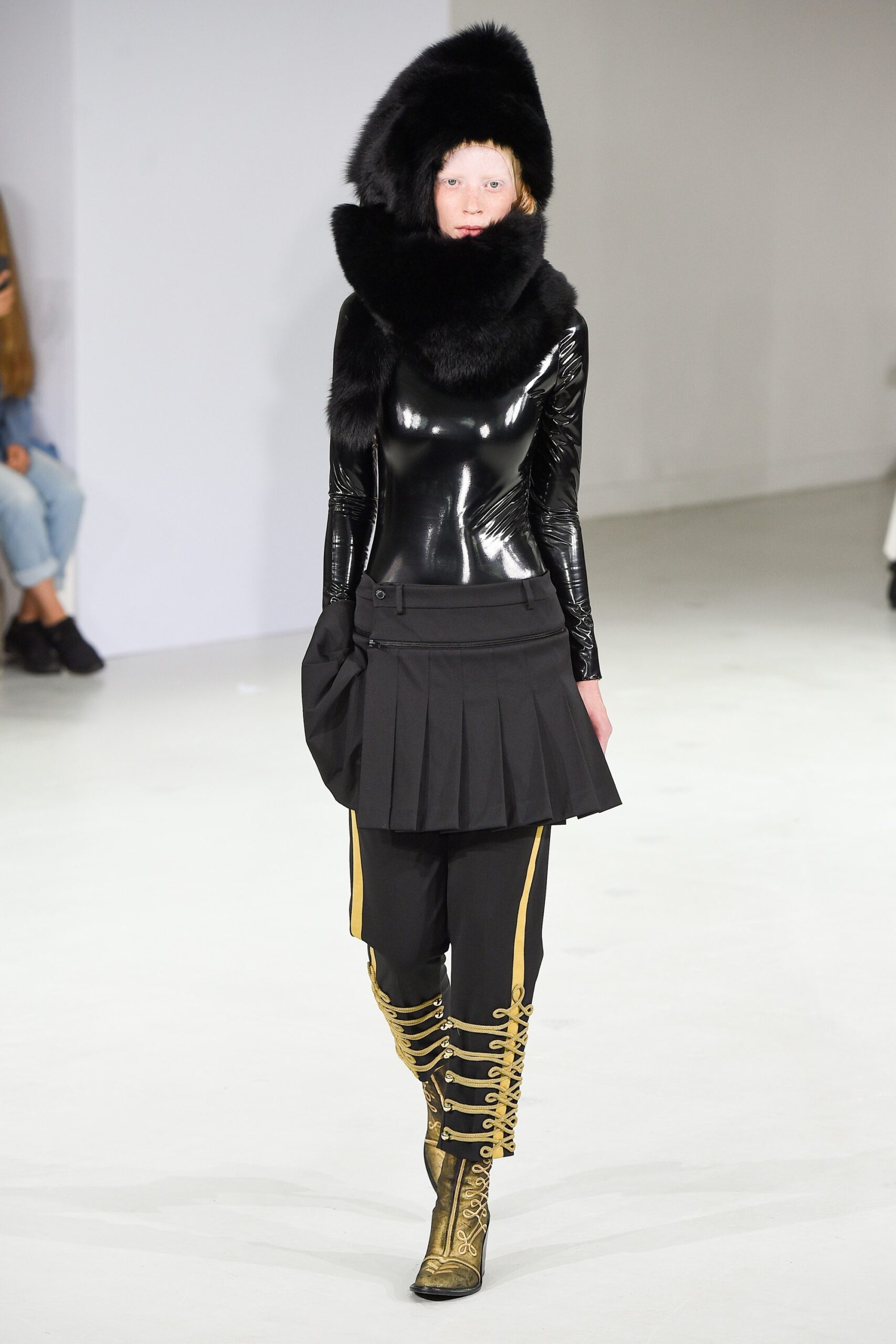 black vinyl sleeveless top with pleated skirt