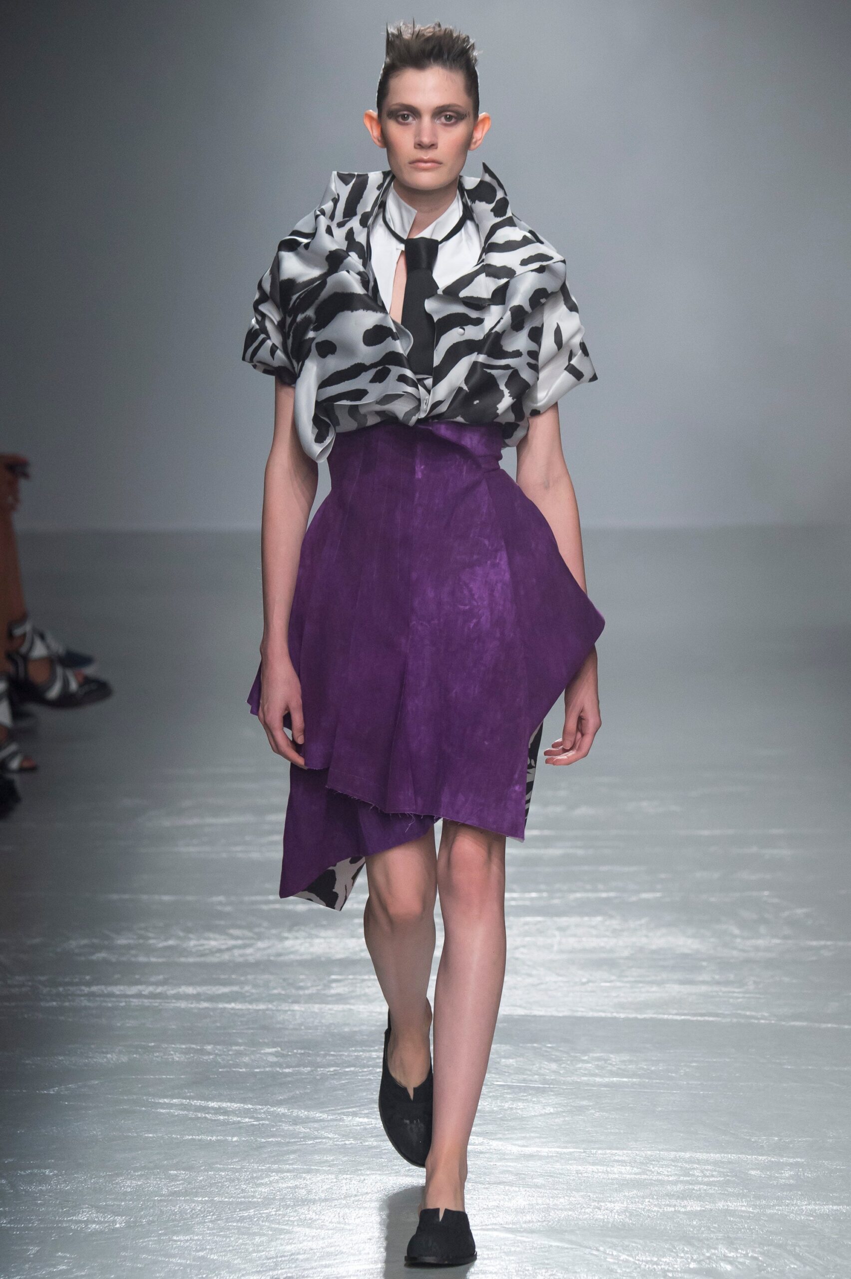 black and white printed top with purple skirt