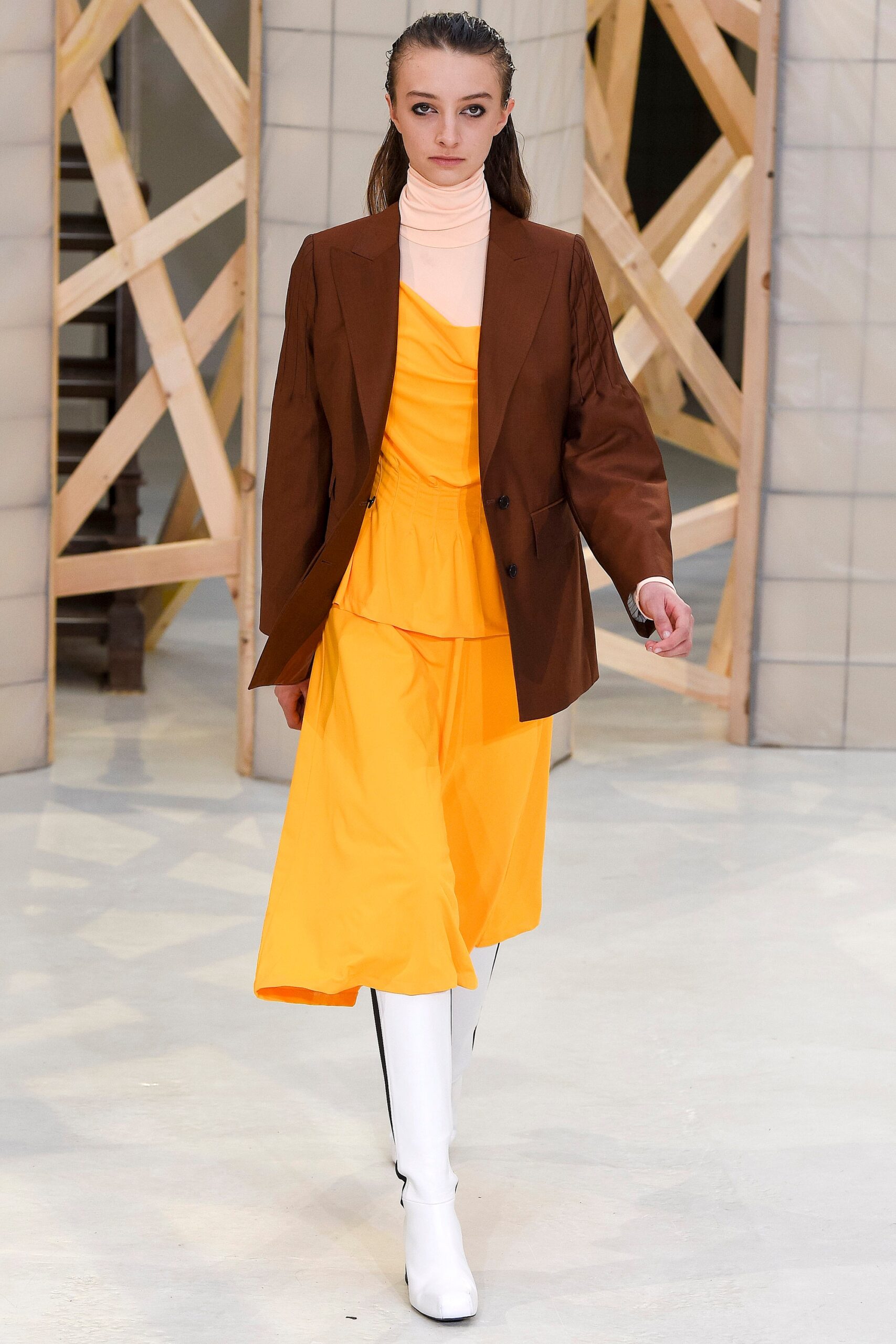 brown blazer with orange top and yellow skirt