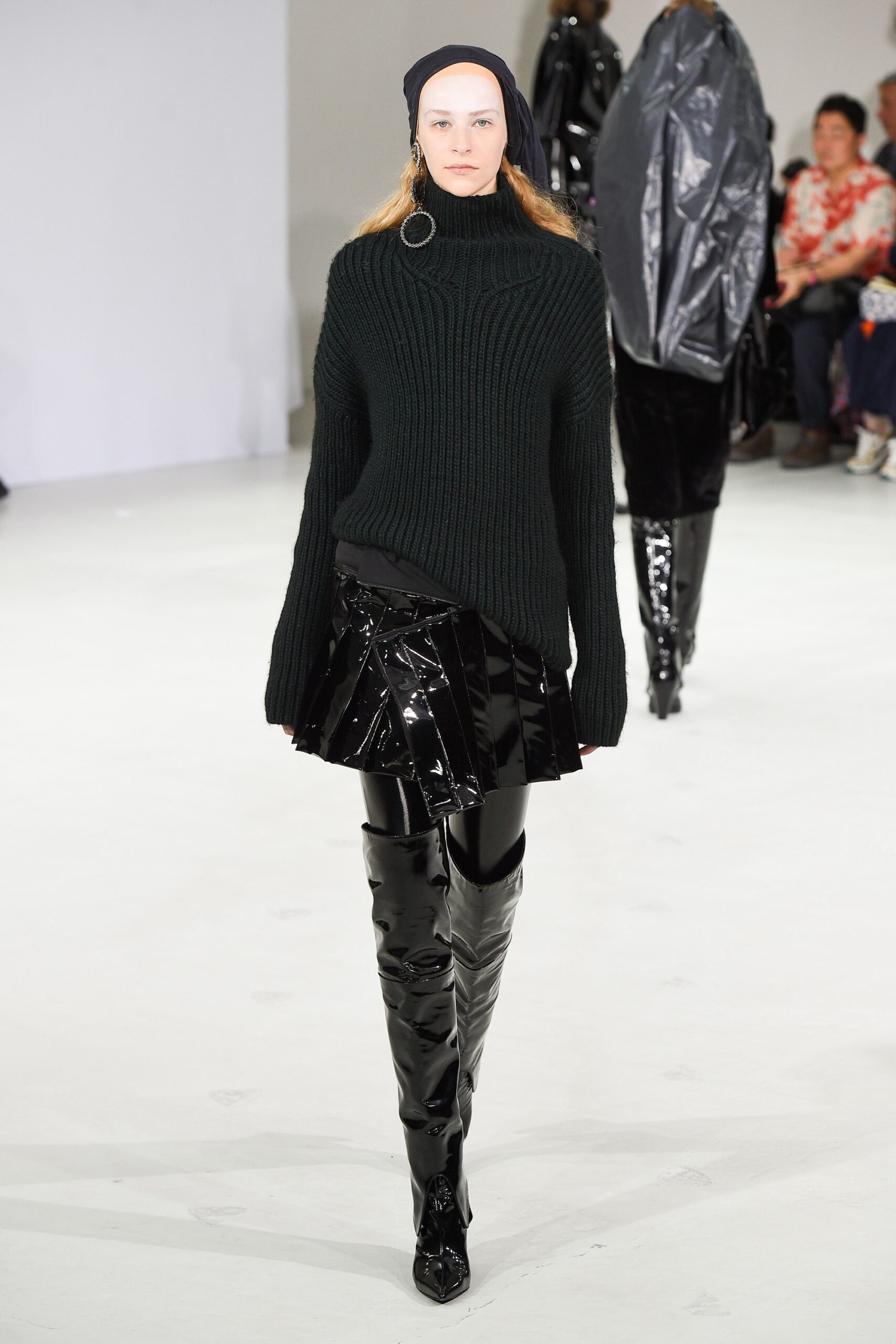 black wool sweater and vinyl skirt