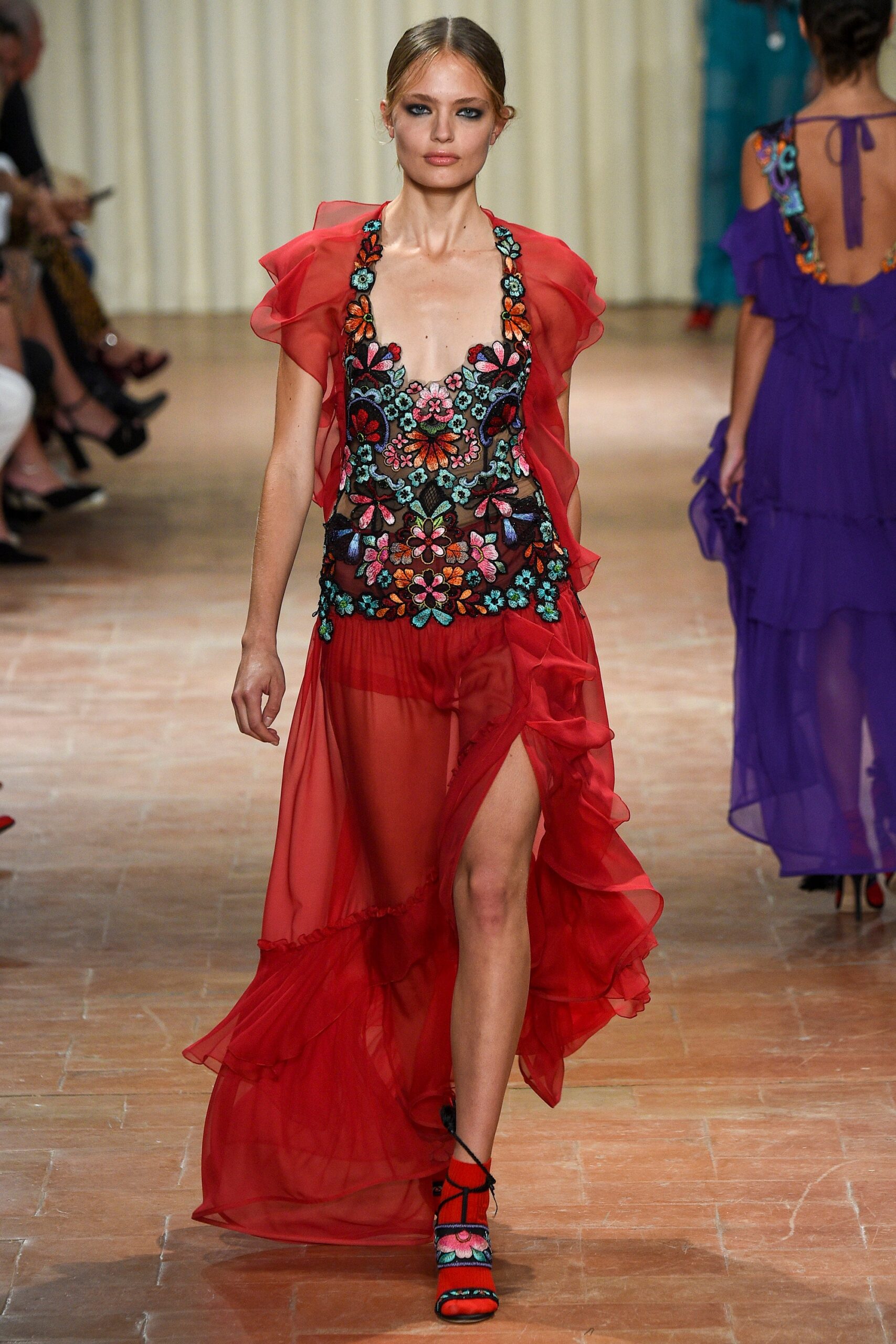 red flowing embroidered gown