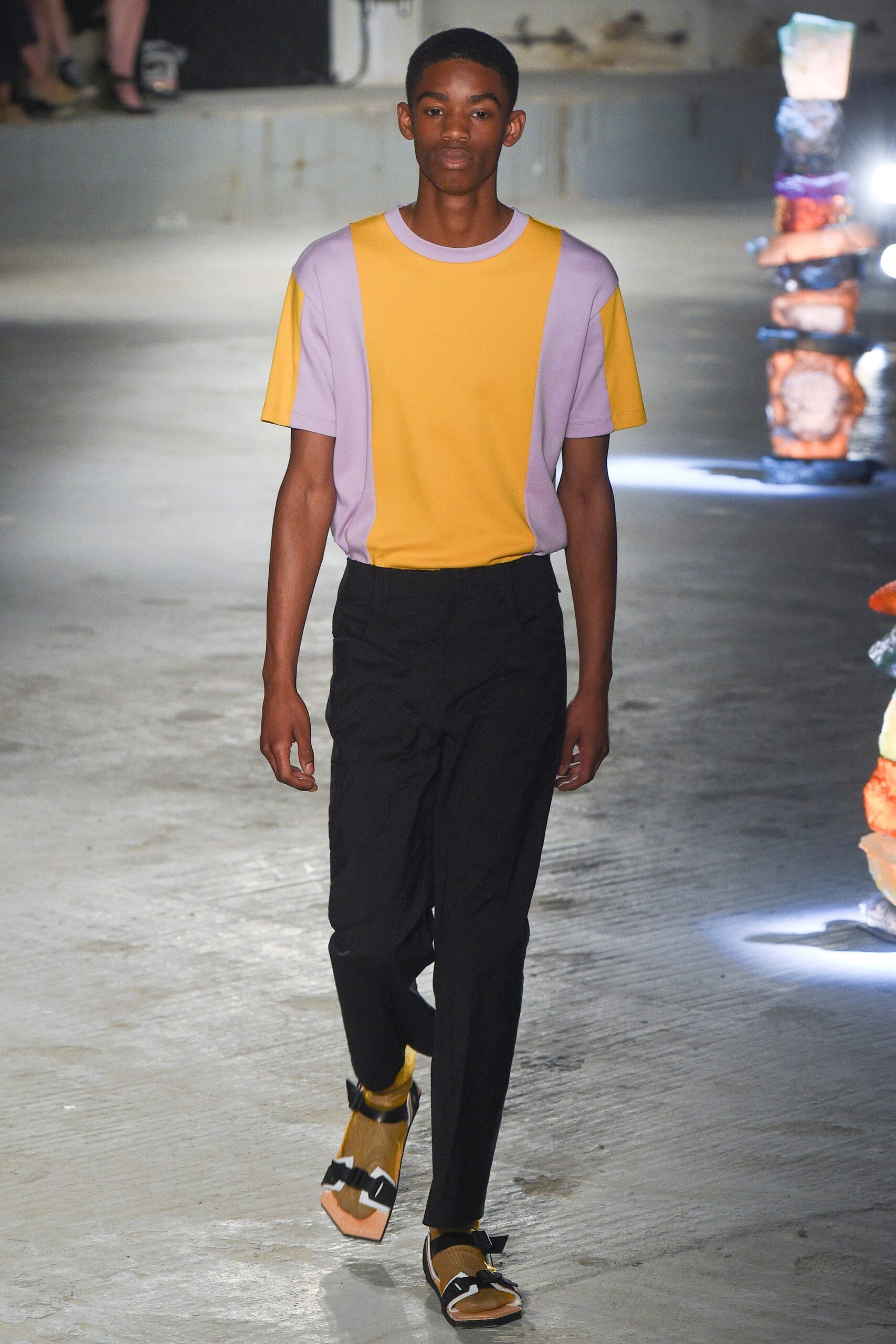 yellow and purple t-shirt with black pants