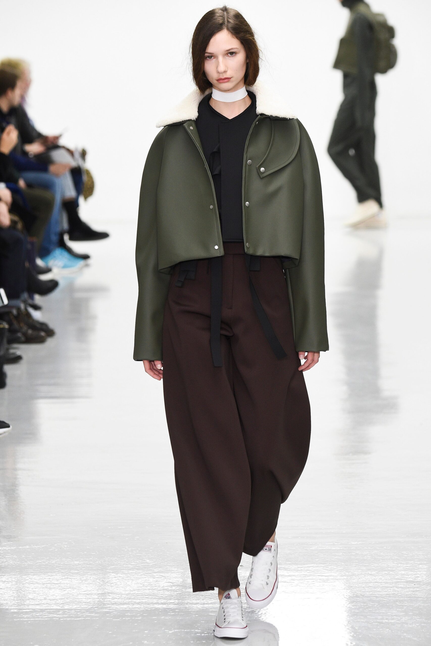 green leather jacket with relaxed pants