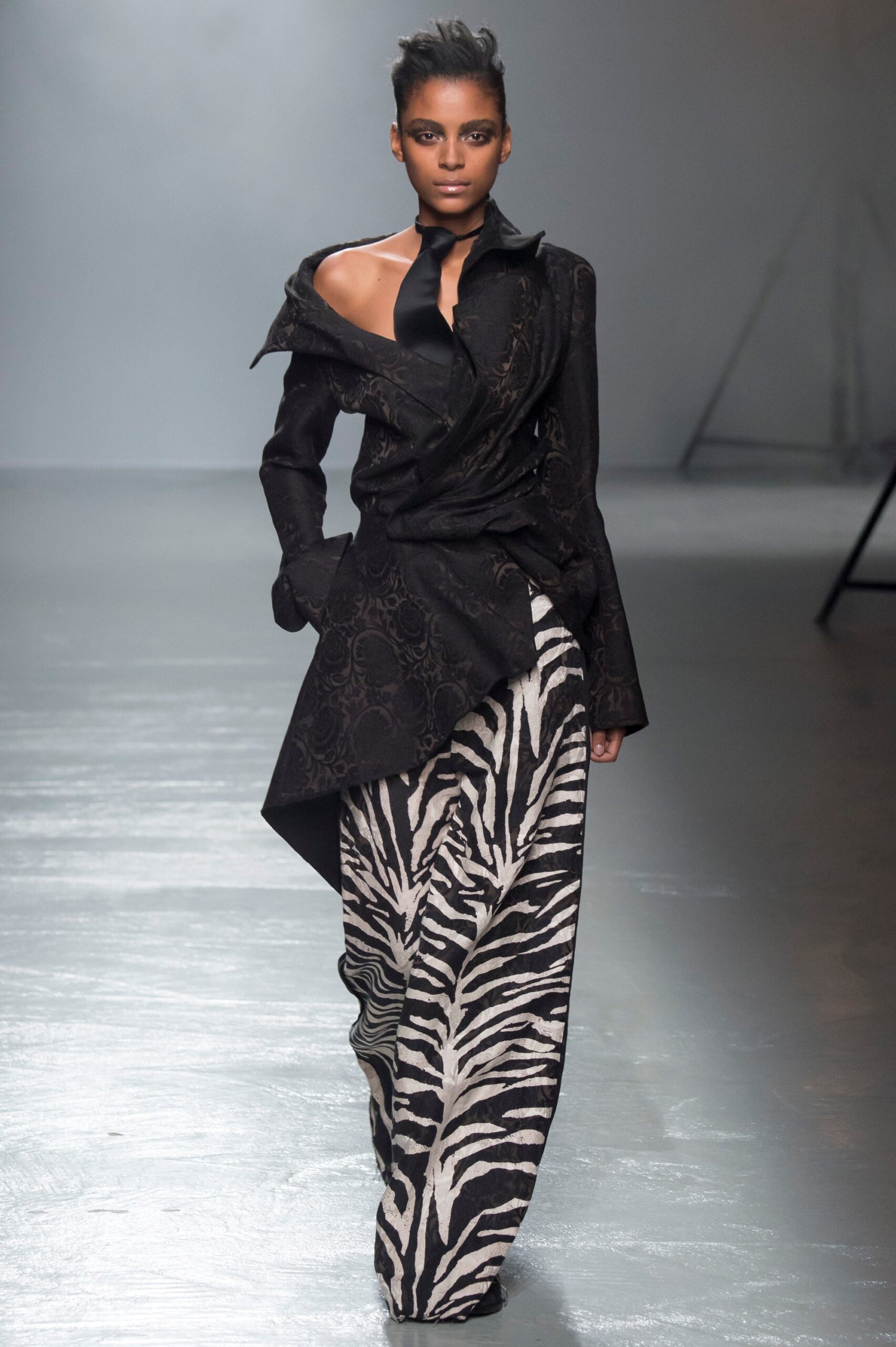 black silk asymmetric jacket with animal-print pants