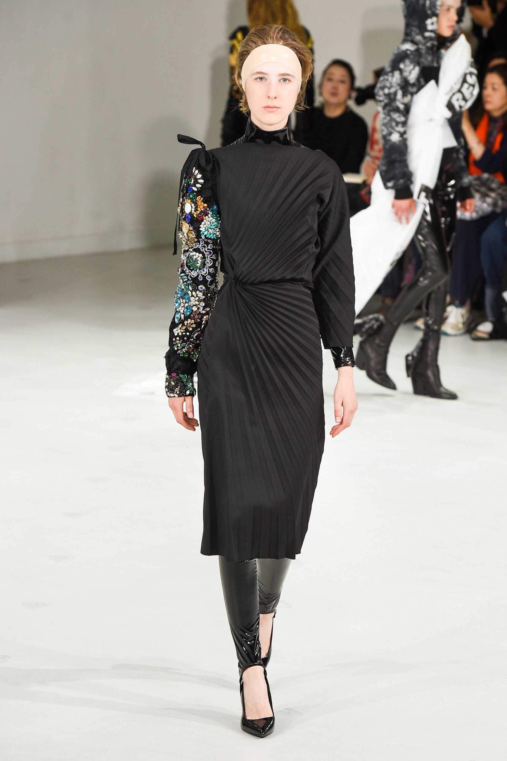 black pleated midi dress with vinyl pants