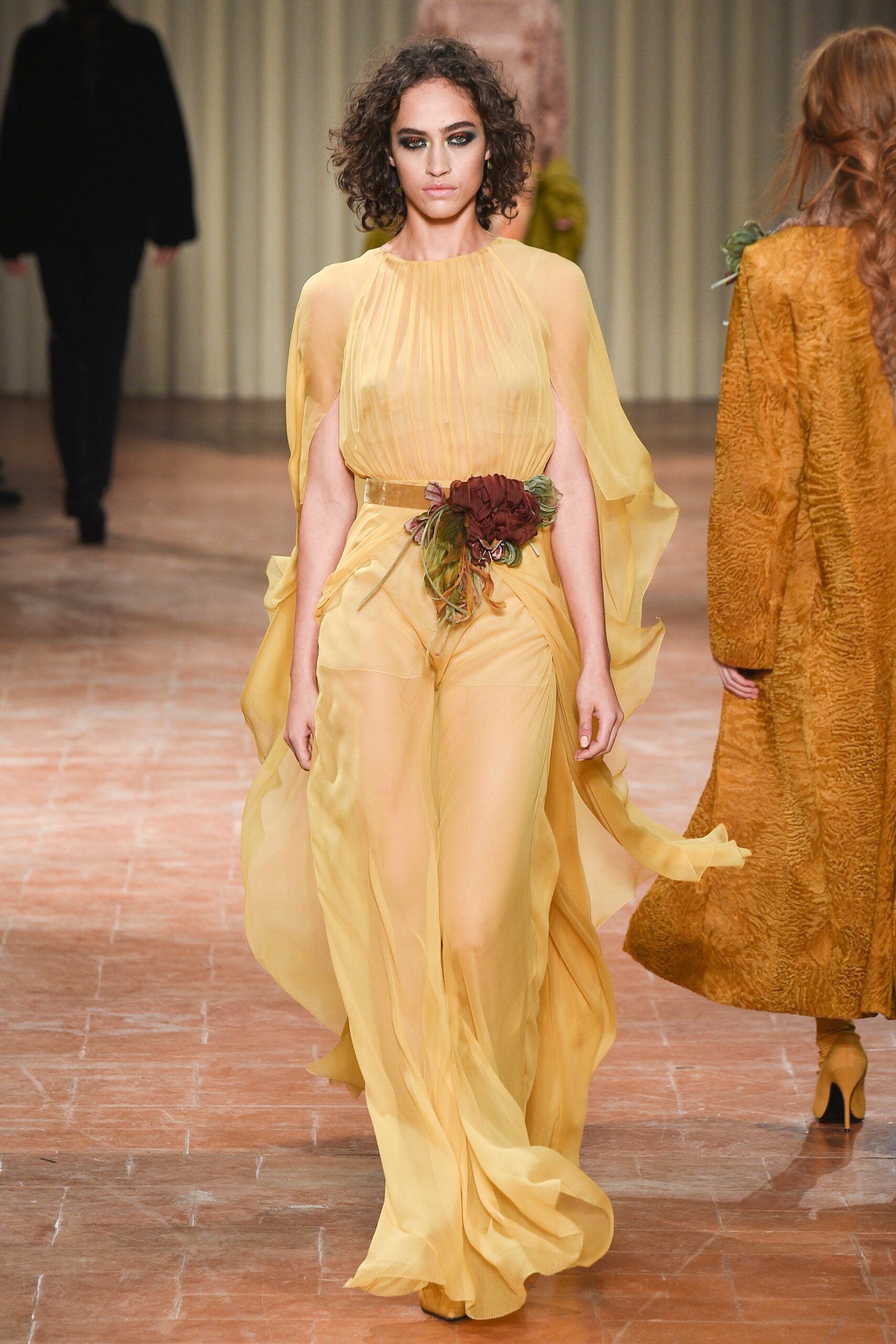 yellow flowing sleeveless gown