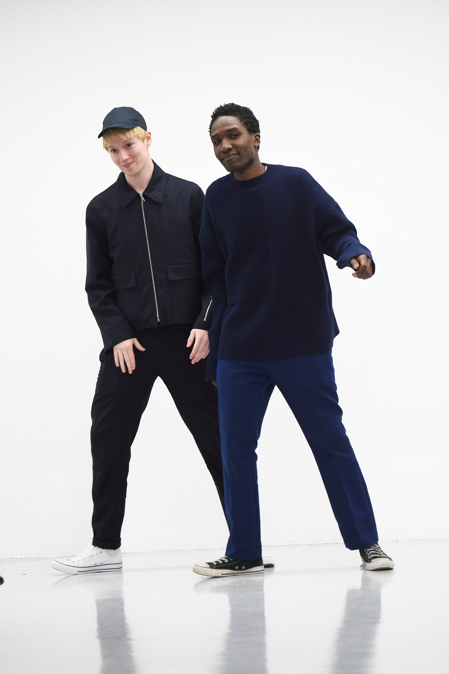 black jacket navy sweater tailored pants