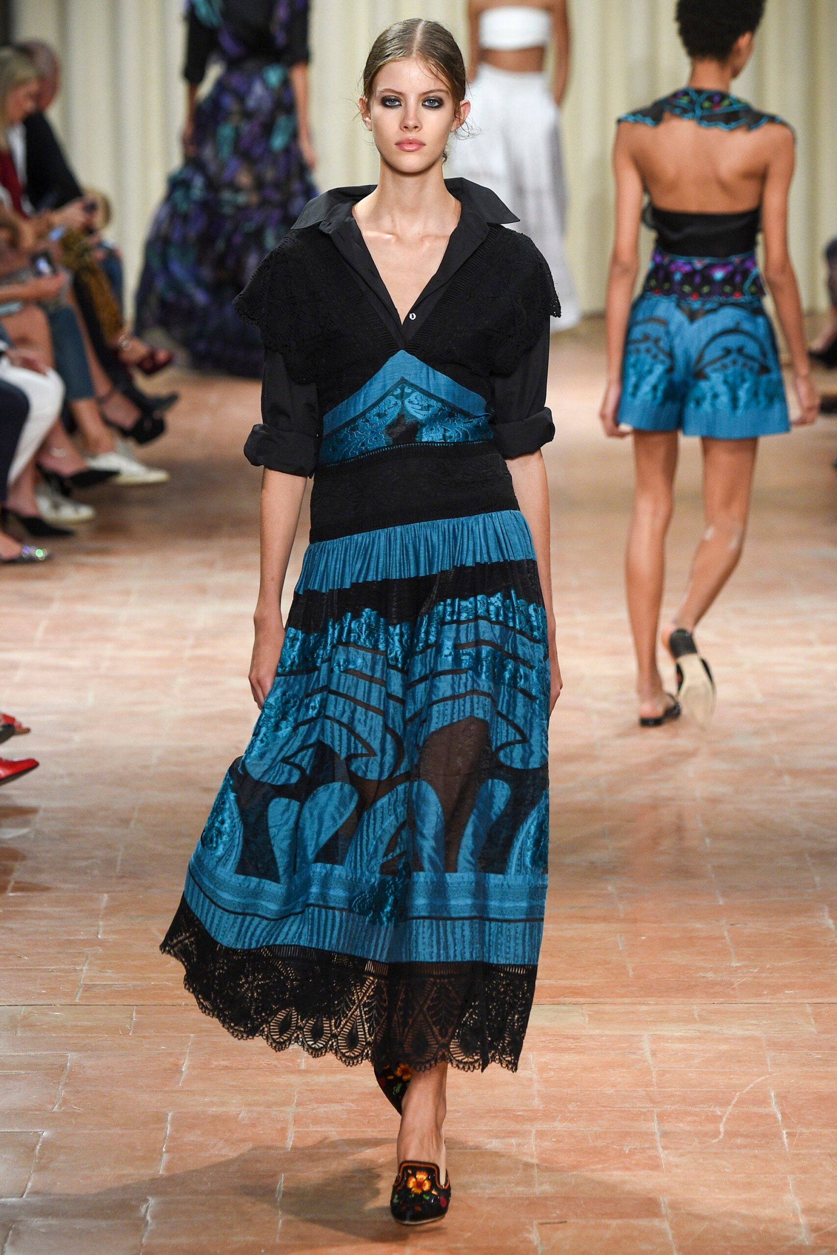 black blouse and blue tiered skirt