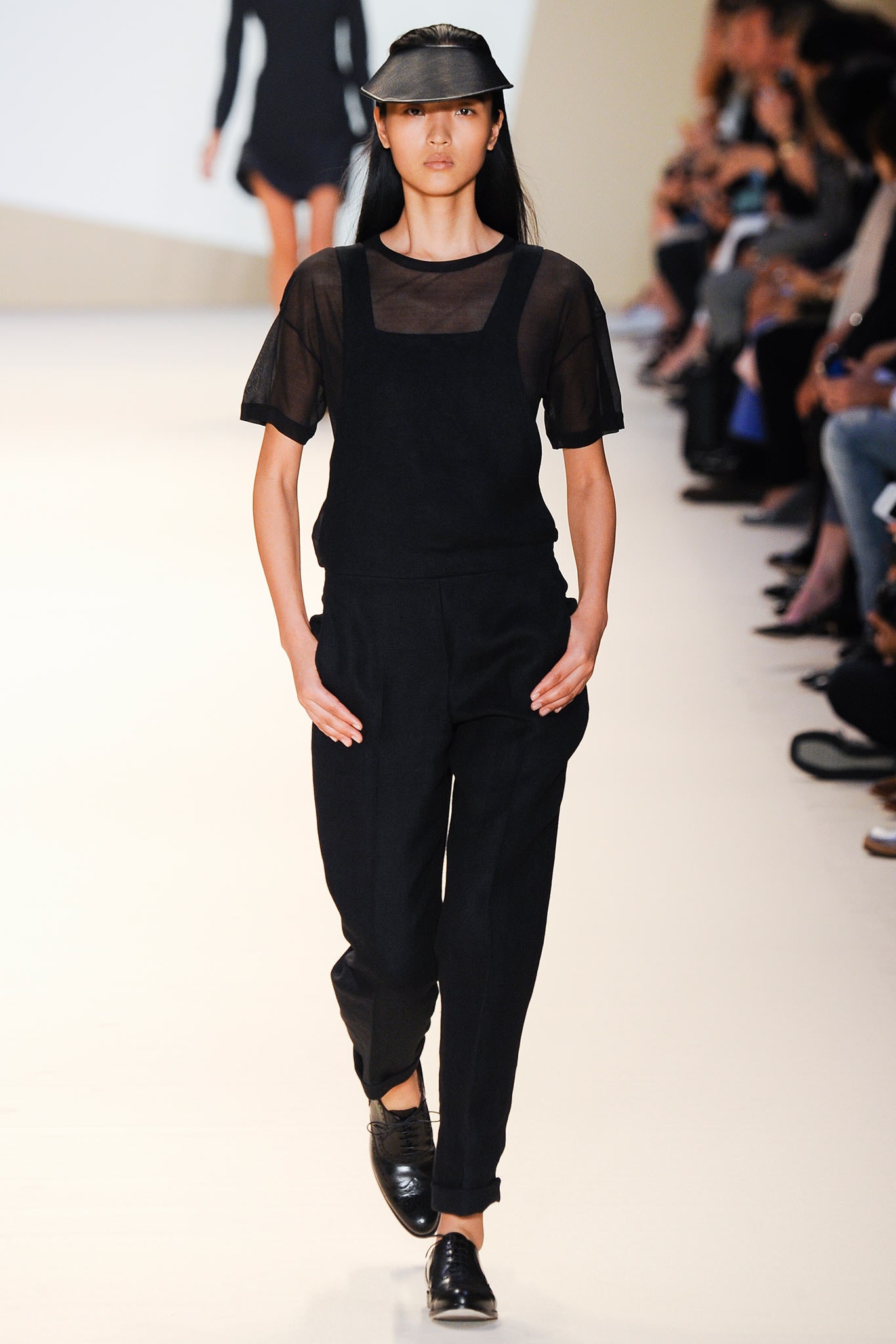 black fitted jumpsuit with sheer top