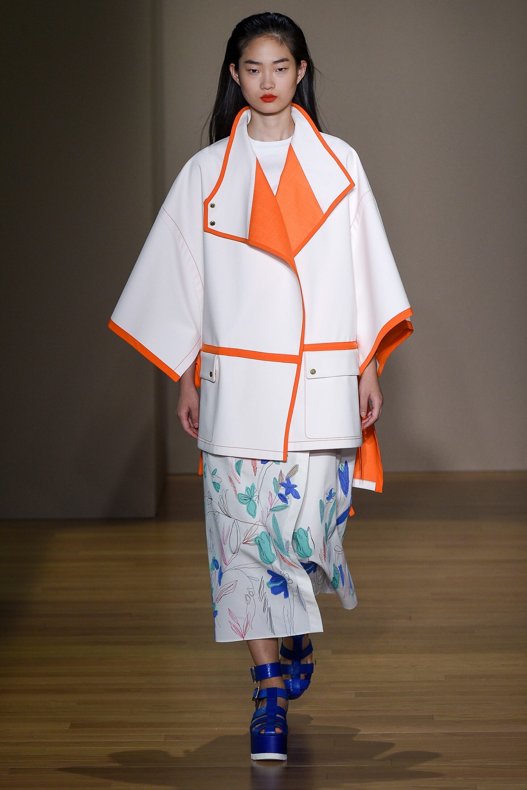 white coat with orange accents