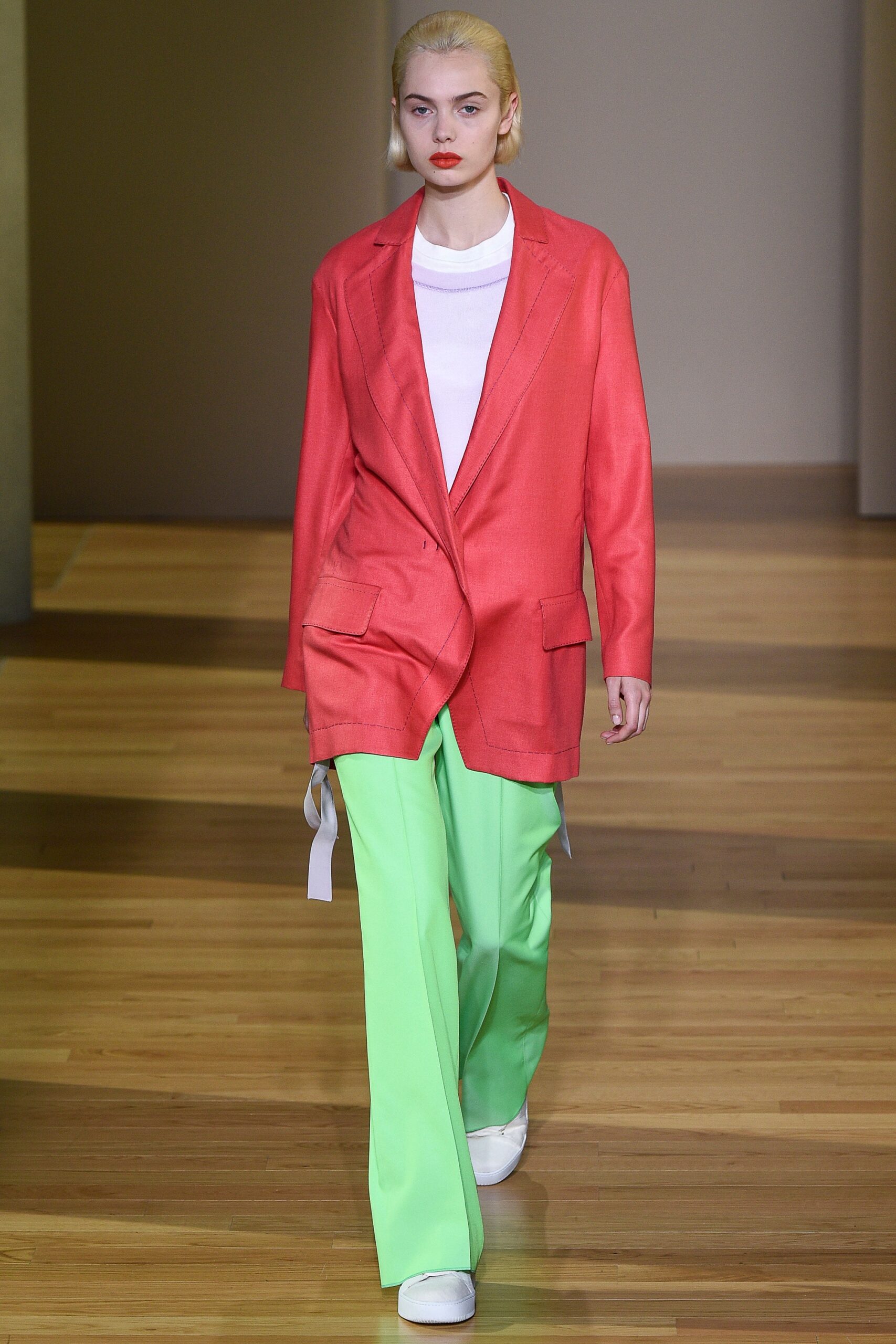 coral blazer with green pants