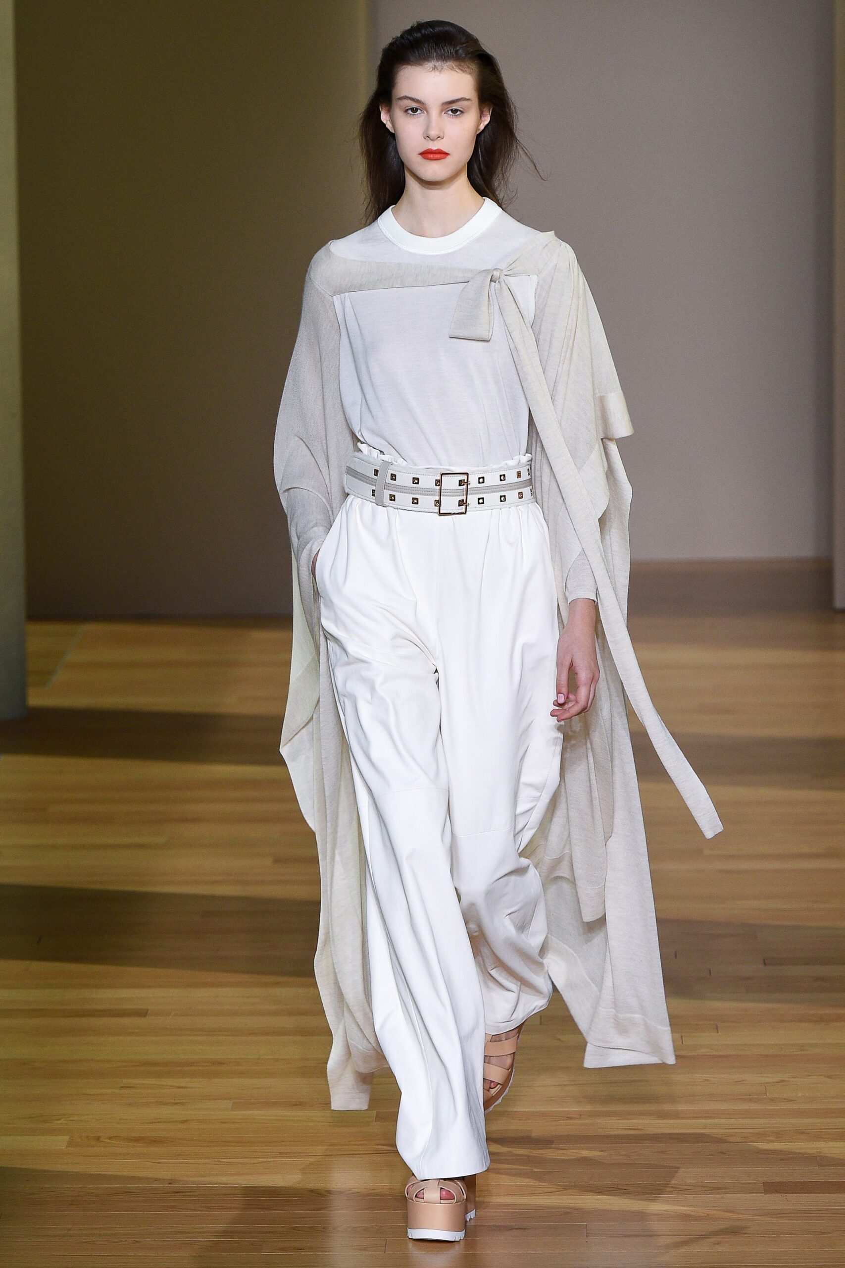 white relaxed top with beige cape