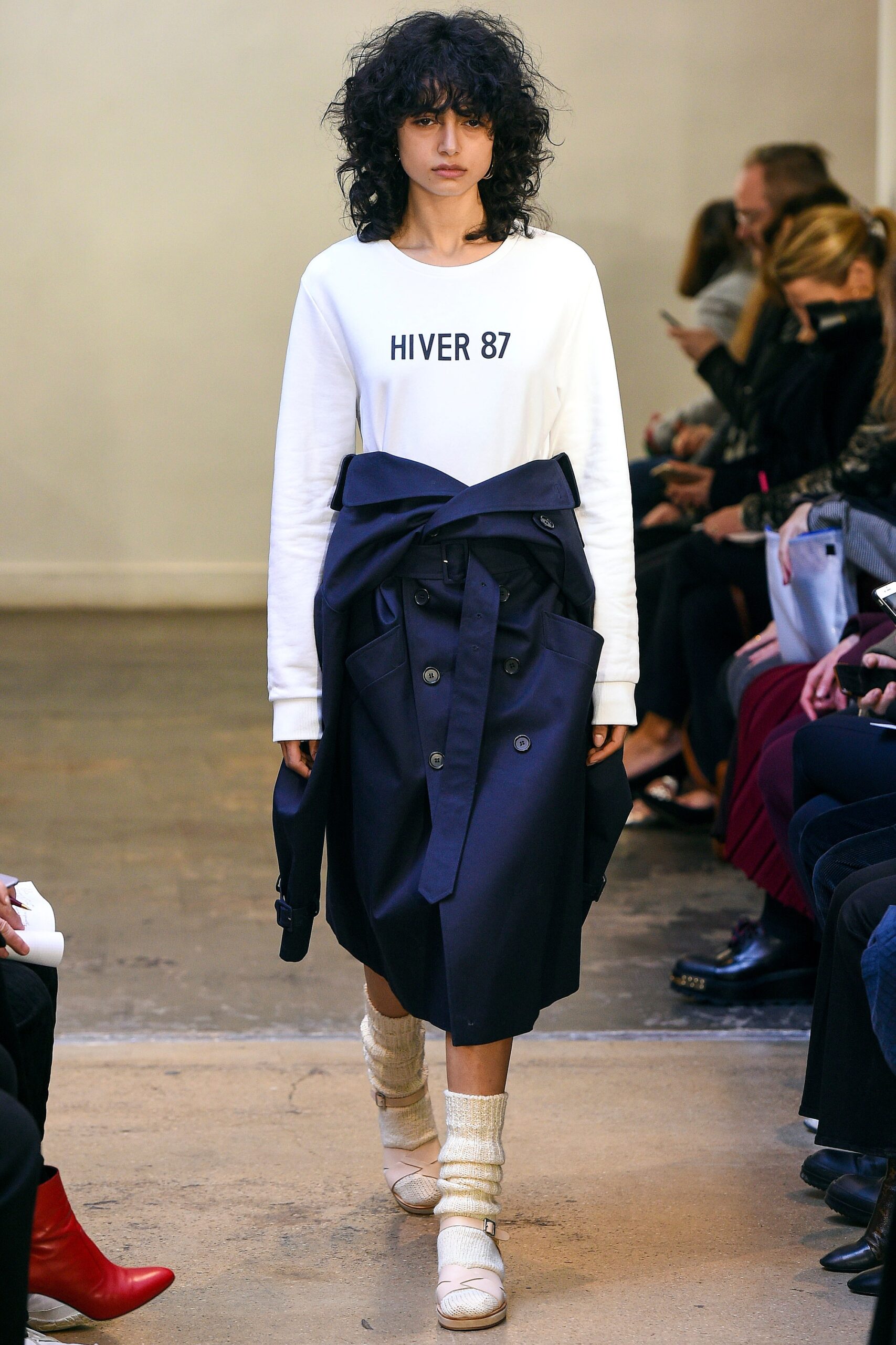white relaxed top with navy trench