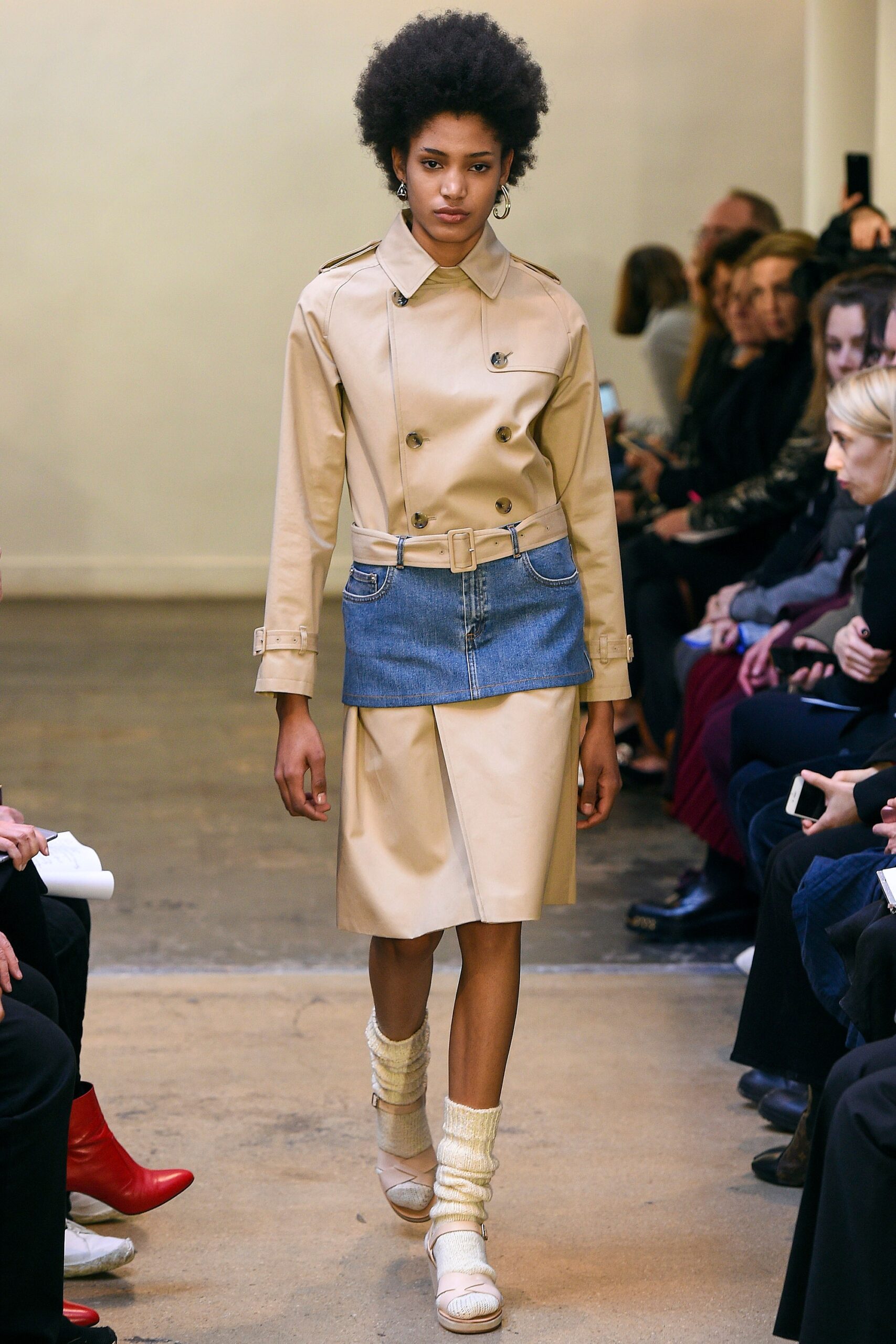 beige trench coat with denim skirt
