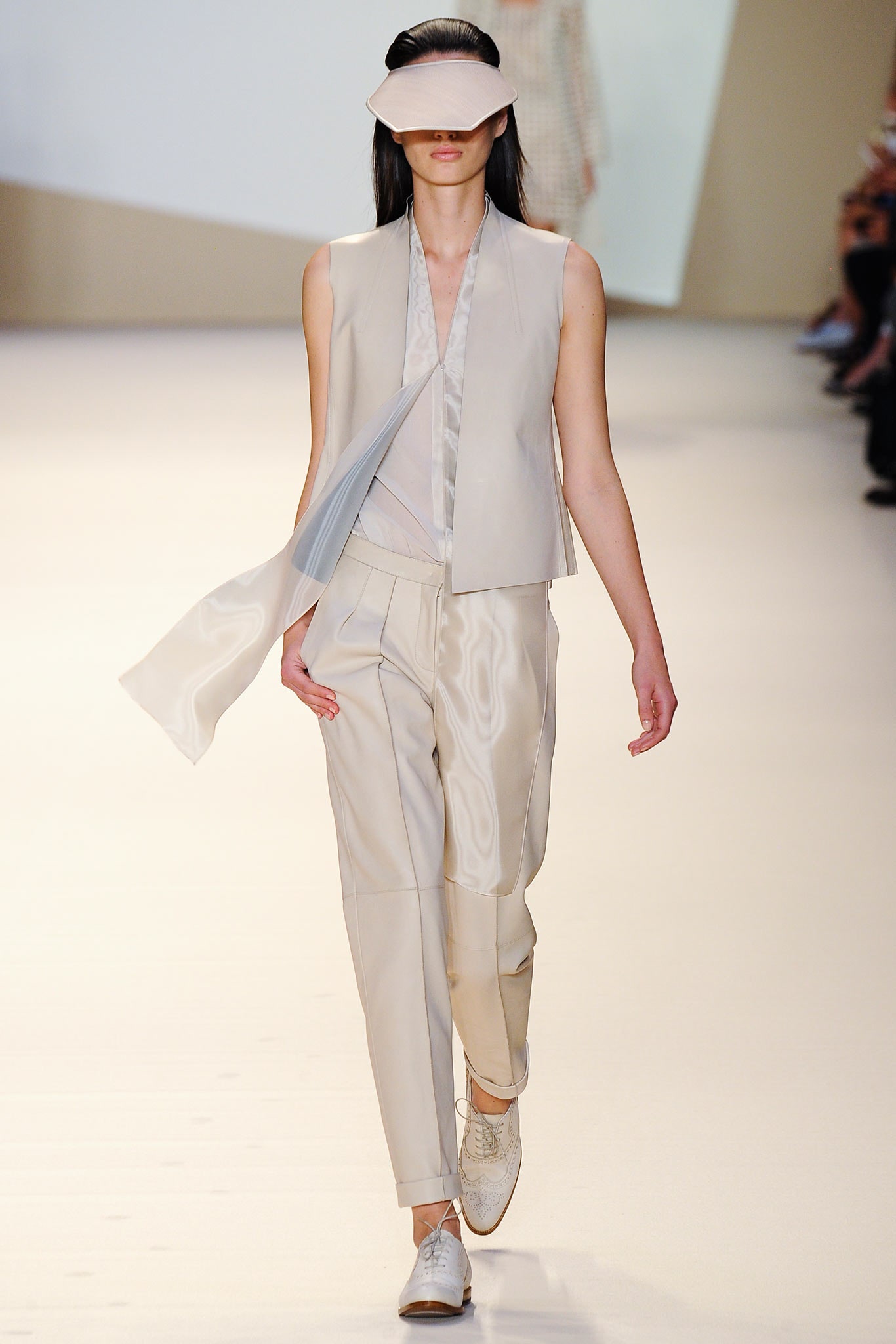 beige silk vest and tailored pants