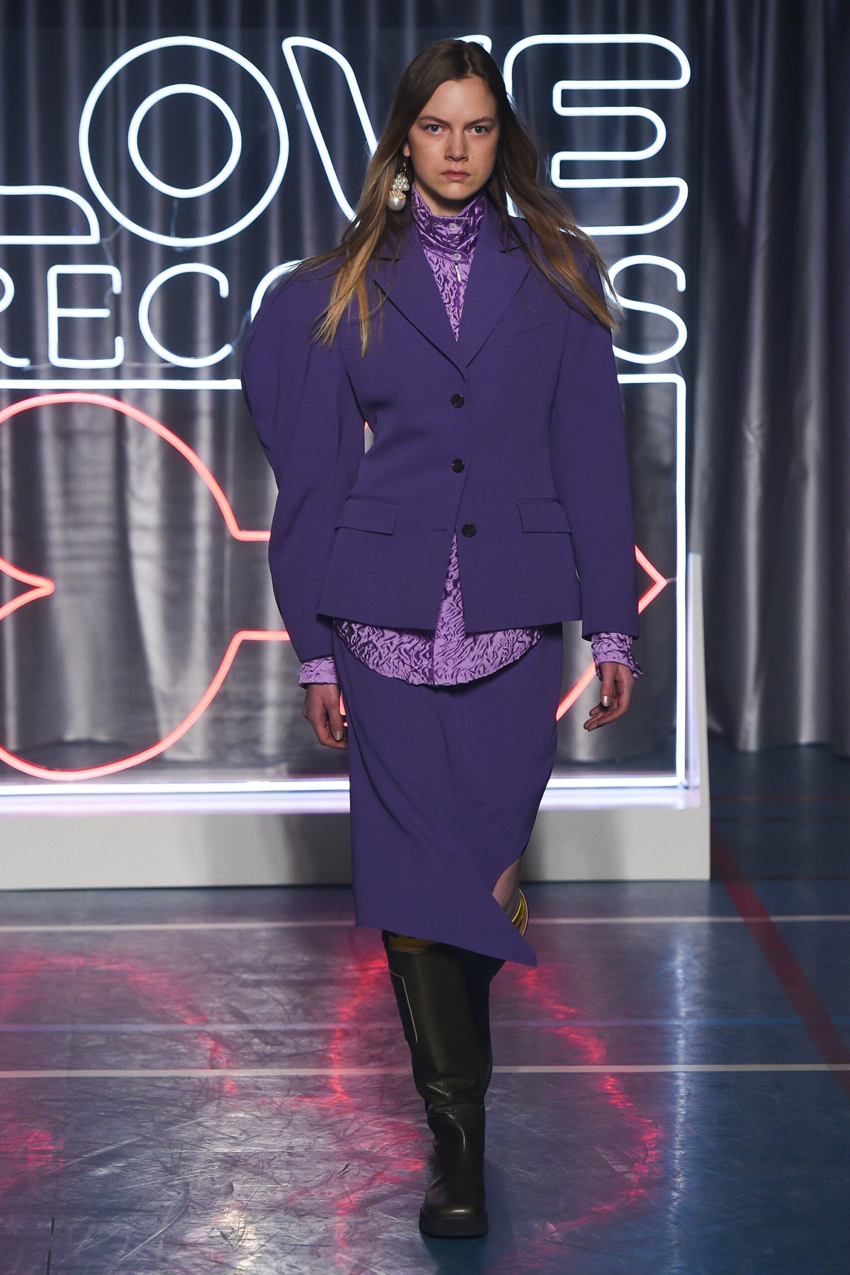 purple tailored suit with pink blouse