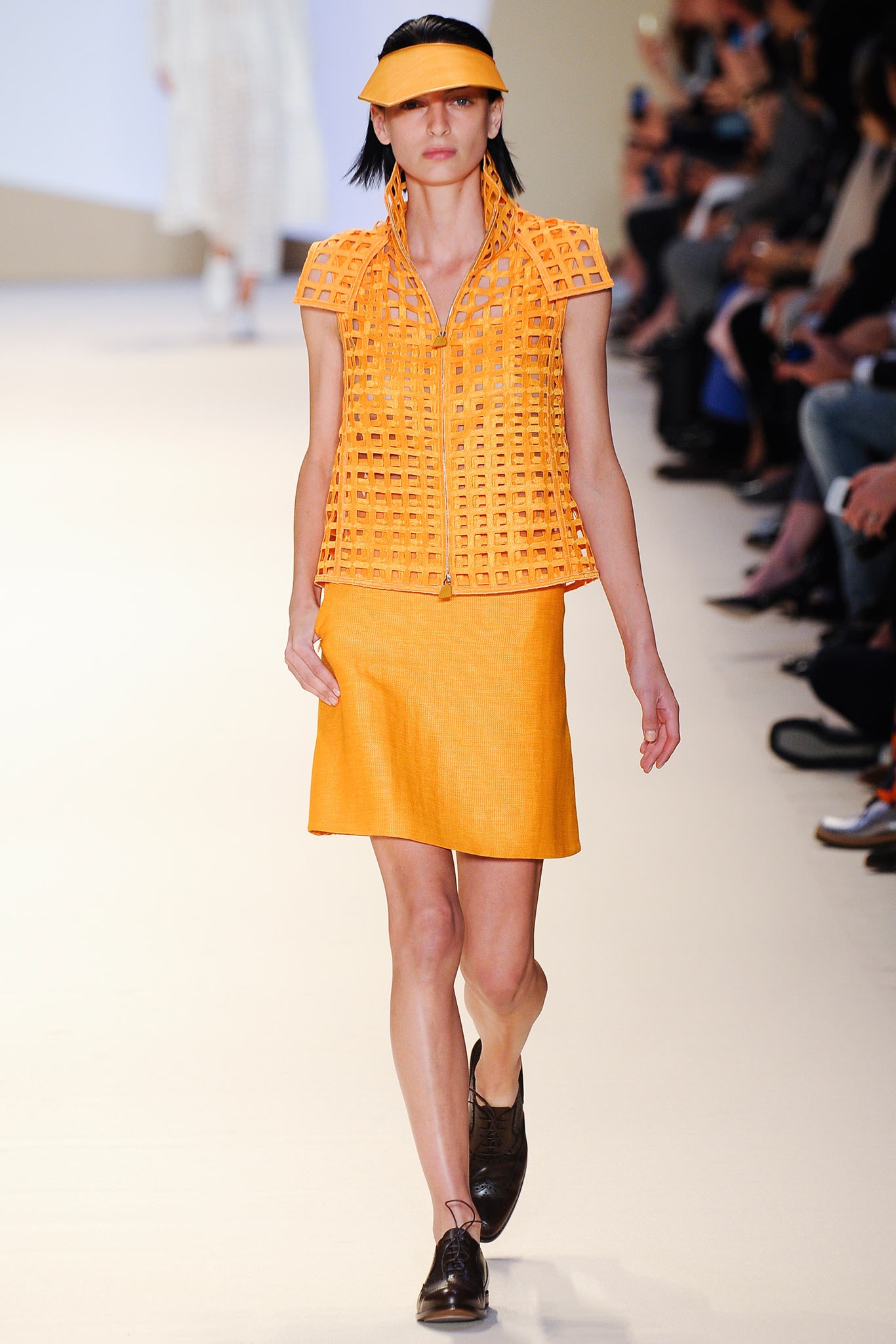 orange fitted top and skirt
