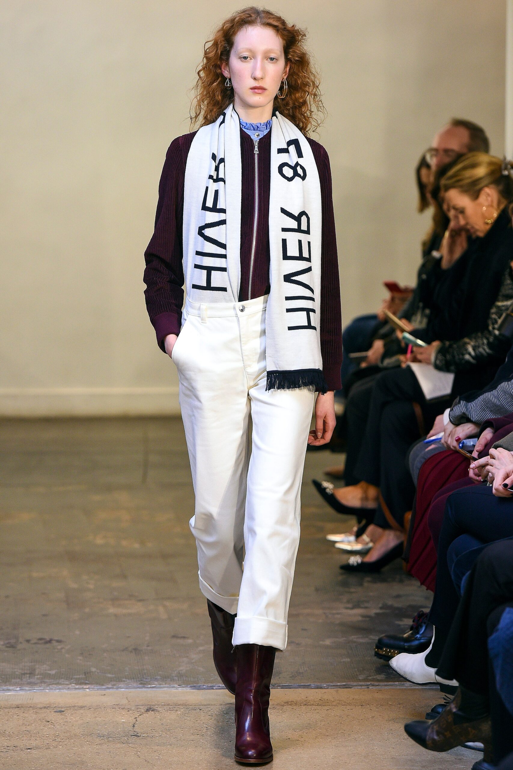 red fitted top with white pants