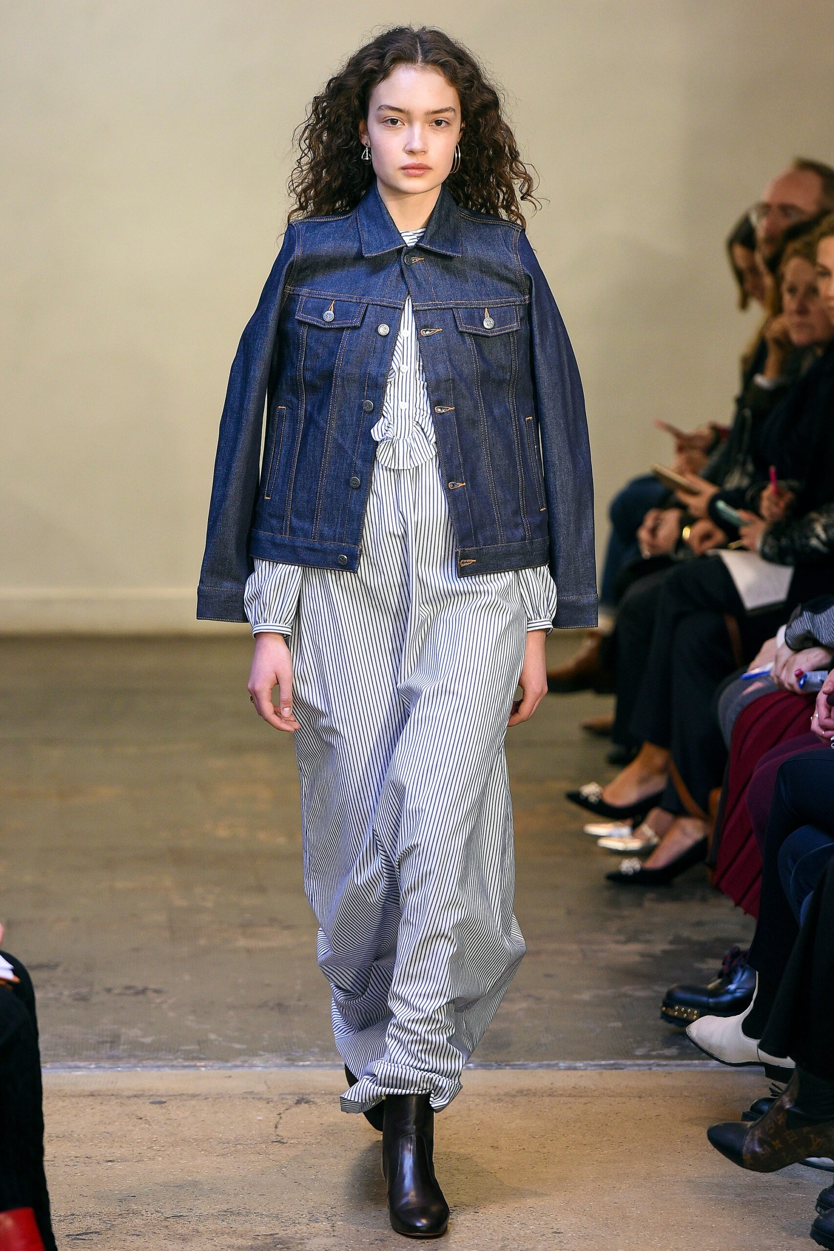 denim jacket over striped dress