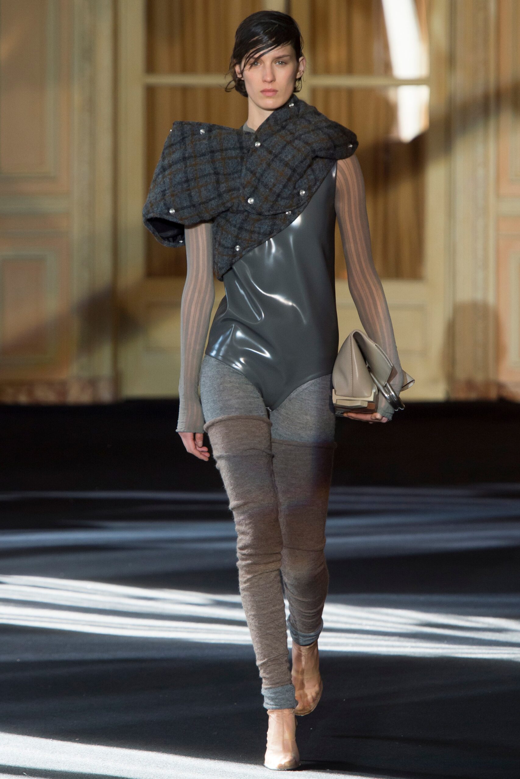 gray vinyl fitted jumpsuit with blue wool cape